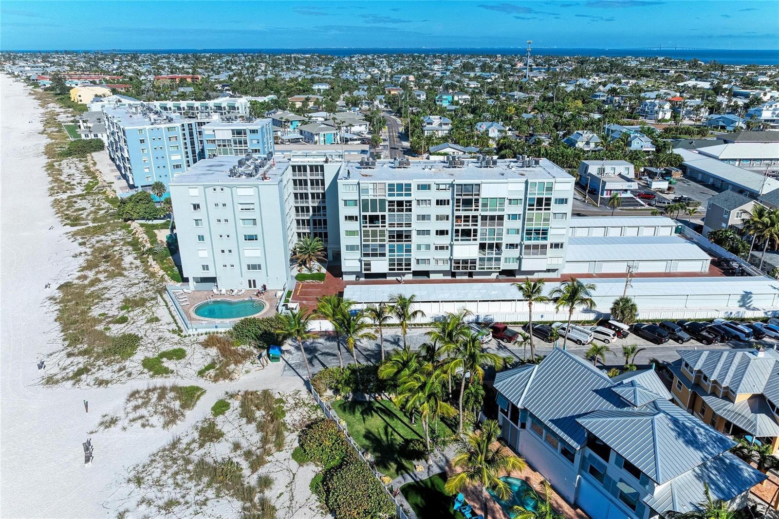 Wake up to salt air and sunset skies in this 2 bedroom, 2 bath beachfront condo on the sugar-white sands of Anna Maria/Holmes Beach. Perfectly positioned on the Gulf, this coastal retreat offers effortless island living with direct beach access just steps from your door. Inside, the light-filled layout features an open living and dining area, well-appointed kitchen, and spacious bedrooms designed for comfort after a day in the sun. Not to mention this unit comes with THREE storage units AND a private garage (STORAGE AREAS #45, 46, & 47 AND GARAGE #38). Enjoy morning coffee with Gulf breezes, evening walks along the shoreline, and year-round sunsets that never get old. Whether you’re searching for a full-time residence, a vacation getaway, or an investment opportunity, this condo places you in the heart of one of Florida’s most beloved barrier islands—close to charming shops, local dining, and the laid-back lifestyle Anna Maria Island is known for. Beach life doesn’t get better than this.