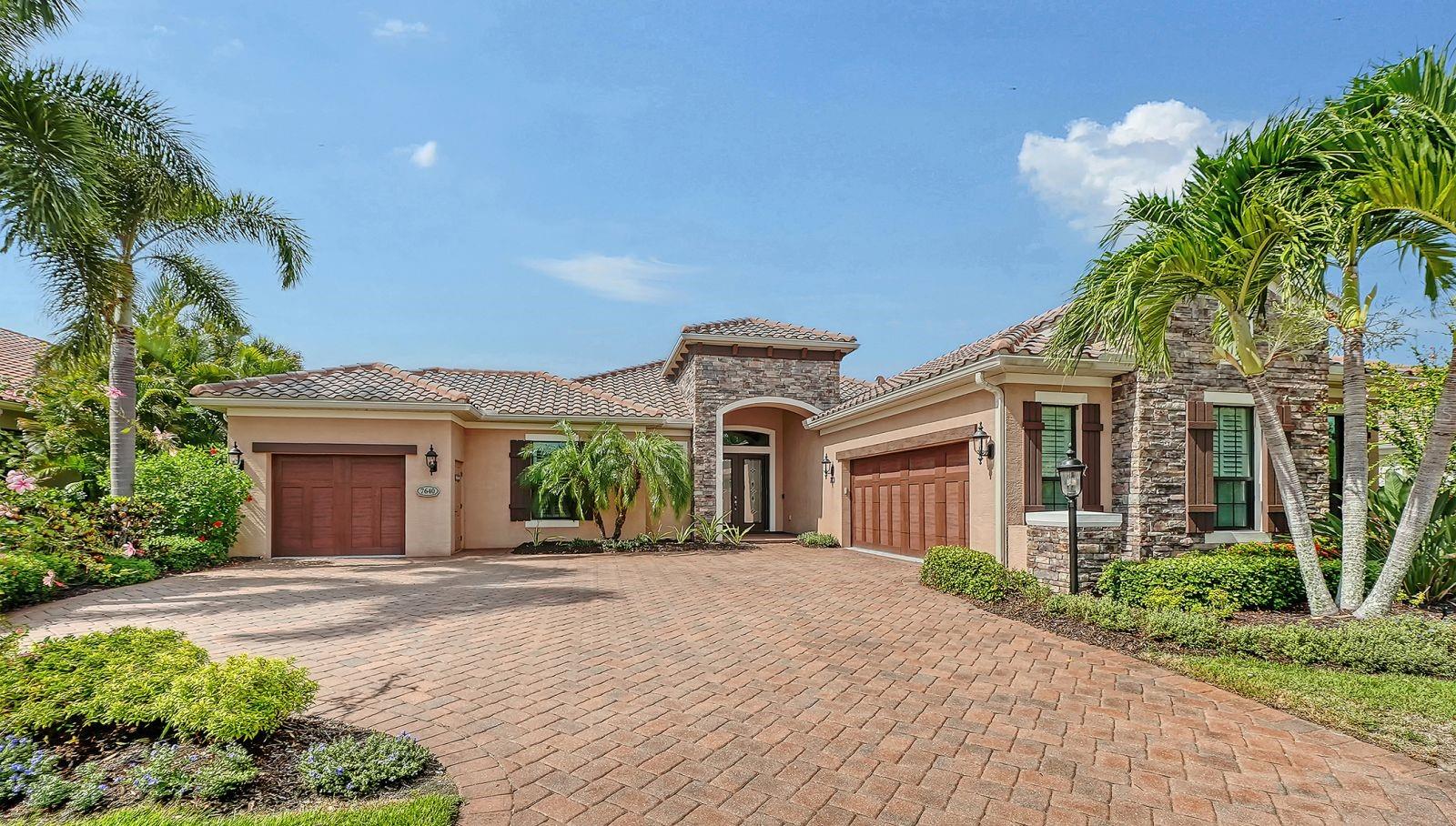 Experience effortless Florida living in this beautifully appointed 3-bedroom, 3-bath home located in the maintenance-free, natural gas community of Country Club East in Lakewood Ranch. Designed with an open great room floor plan, this residence seamlessly blends elegant living spaces with exceptional outdoor amenities. French doors with a transom window open to a large covered lanai overlooking the sparkling pool and spa, fully equipped outdoor kitchen, convenient pool storage room, and peaceful preserve views—creating the perfect setting for relaxing or entertaining.

The gourmet kitchen is a chef's dream, showcasing elegant marble countertops and matching marble backsplash, a gas cooktop, oversized center island with seating and additional storage, appliance garages, trash compactor, ice maker, abundant cabinetry, a casual dining area, and a built-in dry bar with wine refrigerator for effortless entertaining. Decorative tray ceilings and upgraded tile flooring enhance the home's sophisticated design, while impact glass windows and doors, along with a whole-house generator, provide added comfort, convenience, and peace of mind.

The spacious primary suite is a private retreat featuring two walk-in closets and a luxurious en-suite bath with separate vanities, a relaxing garden tub, and a walk-in shower. Two additional guest bedrooms and two full guest baths provide comfortable accommodations for family and visitors. A versatile office is outfitted with a custom built-in desk and Murphy bed, making it ideal for working from home or hosting overnight guests. The generously sized laundry room offers extensive counter space, abundant cabinetry, a laundry tub, and a large storage closet.

Completing the home is an attached two-car garage plus a separate one-car garage, providing plenty of room for vehicles, a golf cart, or additional storage.

Enjoy the maintenance-free lifestyle with lawn care included while taking advantage of Country Club East's resort-style amenities. Optional membership to the Lakewood Ranch Golf & Country Club offers access to championship golf, tennis, pickleball, fitness, dining, and an active social calendar. Conveniently located near shopping, dining, parks, top-rated schools, and the area's world-renowned Gulf Coast beaches, this exceptional home is ready to impress.