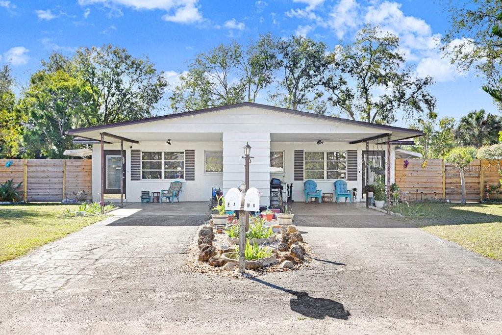 New Price! + $10,000 Seller Credit to be applied to buyers closing costs or to help make the home their own. Home is fully available and easy to show! Tucked away on a quiet street just minutes from some of the worlds most desirable beaches, this well located duplex presents a rare opportunity for both investors and owner occupants in todays challenging market. The home features solid block construction, with a thoughtfully designed permitted addition completed in 1996, and is located in a no flood zone where flood insurance is not required. Designed for flexibility, each side offers a distinct layout to accommodate rental income, multigenerational living, or a live in lease out strategy.  The A side features a one bedroom one bath configuration with a full kitchen and comfortable family room, ideal for long term or seasonal rental. The B side offers two bedrooms and two baths (master suite located at the rear of the home), a spacious family room, eat in kitchen, dining area, a large flex room, and an oversized closet pantry that is large enough to be used as a nursery or home office, providing strong appeal for tenants or extended family living.  Outdoor living is a standout feature with a large backyard that is fully fenced with a privacy fence, oversized private carports perfect for grilling, and two sheds for additional storage. The lot is beautifully landscaped with mature trees, flowering plants, and shrubs that enhance privacy and curb appeal. A well water spigot supports irrigation while the home itself is connected to city water and city sewer.  Located just two miles from IMG Academy and six miles from Coquina Beach, this property benefits from consistent demand and strong location appeal. Many newer items add value and peace of mind including bathroom vanities, washer, dryer, well pump, and water heaters. With no HOA restrictions and a location that is hard to beat, this property delivers a smart two for one solution offering income potential, lifestyle flexibility, and long term value in a market where smart buys matter more than ever. Visit Homes for a full 3D walk-through.