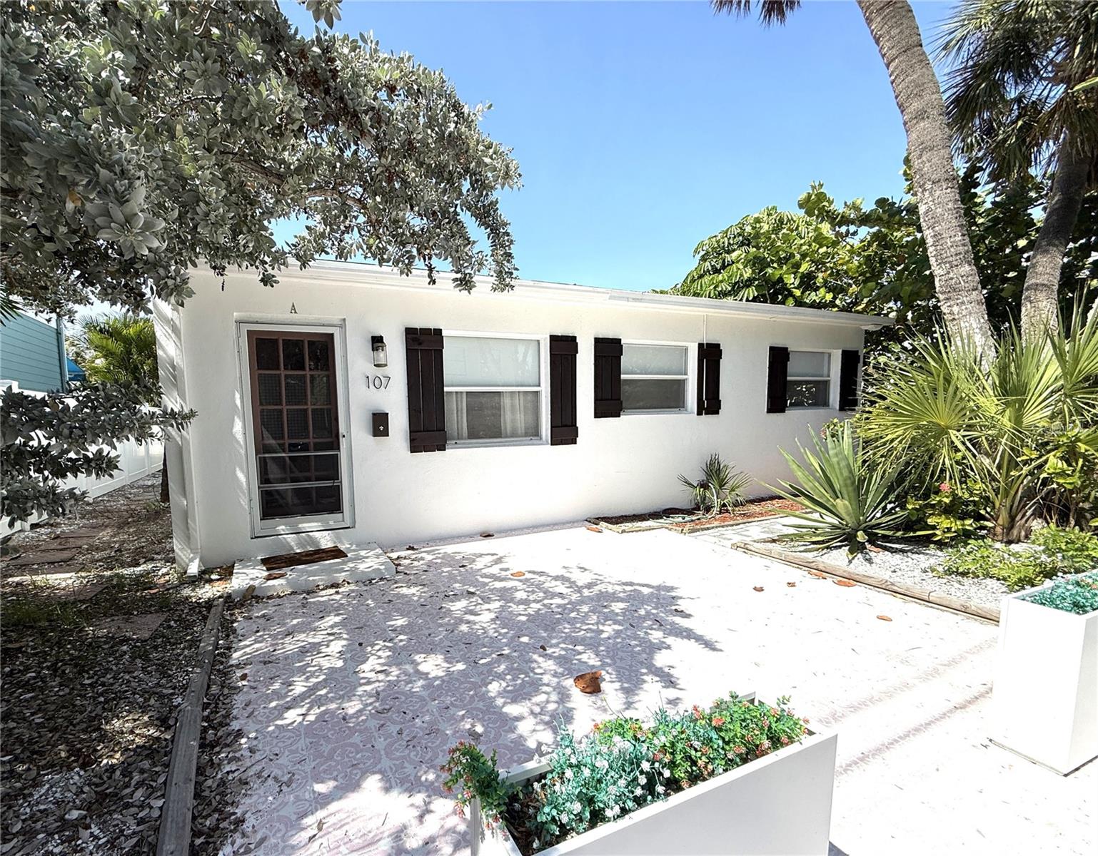 Exceptional four-plex investment opportunity just steps from the beach in the heart of Pass-a-Grille. This fully renovated historic property offers four income-producing units (two 2-bedroom/1-bath units, one 1-bedroom/1-bath unit, and one studio) well suited for rental use. Renovated in 2025, the property features brand-new appliances, modern finishes, a shared laundry room, and turnkey interiors while preserving its classic coastal character. A beautifully designed outdoor lounge enhances guest appeal.  Pass-a-Grille is widely regarded as a premier beach destination, attracting visitors from across the country for its walkable charm, dining, and Gulf sunsets, supporting strong rental demand.  Ask about a $25k seller credit toward closing costs for using the seller’s preferred lender.