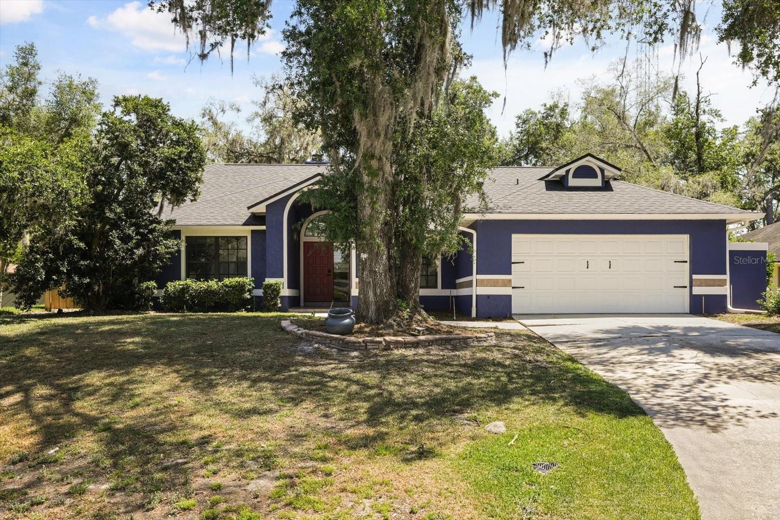 One or more photo(s) has been virtually staged. Welcome to this beautifully updated home in the charming neighborhood of Longwood Green, zoned for the highly rated Lake Mary High School. This property perfectly blends comfort, modern design, and Florida living with its screen-enclosed pool, covered lanai, and fully fenced backyard, creating a private outdoor retreat ideal for relaxation and entertaining.

Inside, you’ll find a completely remodeled kitchen showcasing solid wood, soft-close cabinets, quartz countertops, a stylish tiled backsplash, new sink & faucet, and sleek stainless and black appliances. The kitchen also features a breakfast bar, dinette space, and recessed lighting, making it both functional and inviting. The open living and dining area is warm and welcoming with engineered hardwood flooring, updated lighting and fans, and a brick wood-burning fireplace as the centerpiece. Triple sliding doors lead to the covered lanai and pool area, while skylights and a large fixed window fill the room with natural light.

The split-floor plan provides privacy, with the primary suite located at the back of the home and direct access to the pool. The remodeled primary bathroom impresses with a dual-sink vanity topped with granite counters, a large tiled shower with a glass enclosure, and a luxury automatic toilet. The walk-in closet, lined with aromatic cedar, adds a touch of character and practicality.

Three spacious secondary bedrooms each feature large built-in closets and share a beautiful full bath with a tub/shower combo, newer toilet, wainscoting, and painted cabinets. A sizable hallway closet offers ample storage and there's a door close by with convenient access to the pool area. The inside laundry room has built-in cabinetry, a countertop for folding, and comes complete with washer and dryer.

Additional updates include fresh interior and exterior paint, new lighting and ceiling fans throughout, Water Heater (2026) and a brand-new roof (2024) for peace of mind. This home combines modern updates with timeless charm, all in a well-established community close to parks, dining, shopping, and top-rated schools. It’s the perfect place to call home.