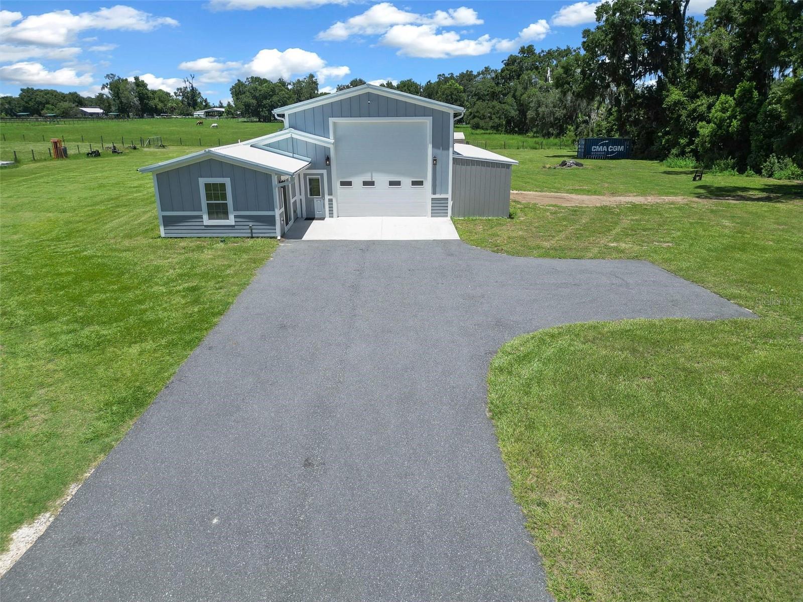 LOCATION! LOCATION! A BEAUTIFUL BARNDOMINIUM SITTING ON 3.05 ACRES CENTRALLY LOCATED BETWEEN OCALA AND GAINESVILLE! THIS IS DEFINITELY A ONE OF A KIND PROPERTY! THE HOME CONSISTS OF 3 BEDROOMS AND 2.5 BATHS, VINYL FLOORING THROUGHOUT, GRANITE COUNTERTOPS, AND ALL STAINLESS STEEL APPLIANCES! THE GARAGE CONSISTS OF 1,138 SQUARE FEET AND IS FULLY INSULATED AND RUNS OFF OF ITS ON SEPERATE AC IF YOU SO DESIRE! ON ONE SIDE OF THE GARAGE YOU HAVE YOUR 945 SQ FT 3 BED 2 BATH HOUSE AND ON THE OTHER SIDE OF THE INSULATED AIR CONDITIONED GARAGE YOU HAVE 470 SQ FT WHICH CONSISTS OF A STORAGE AREA, A 1/2 BATH, AND A LARGE ROOM THAT COULD BE USED FOR STORAGE OR TURNED INTO A 4TH BEDROOM. OFF THE BACK OF THE HOUSE YOU HAVE A COVERED PATIO PERFECT FOR GRILLING OUT AND A BIG SCREEN TV ON THE WALL! THE ENTIRE HOUSE IS SPRAY FOAMED INCLUDING THE WALLS MAKING IT SUPER ENERGY EFFICIENT. THE PROPERTY CONSISTS OF 3.05 ACRES BUT THE FULLY FENCED IN AREA CONSIST OF 2 ACRES. THE HOUSE IS PERFECTLY LOCATED ON HWY 329 IN SPARR WHICH MEANS YOU'RE ONLY 2 MINUTES FROM 441, 10 MINUTES FROM I75, 20 MINUTES FROM OCALA, 30 MINUTES FROM THE WORLD EQUESTRIAN CENTER AND 45 MINUTES FROM GAINESVILLE! THE PROPERTY IS ZONED AGRICULTURE SO BRING THE ANIMALS WITH YOU!