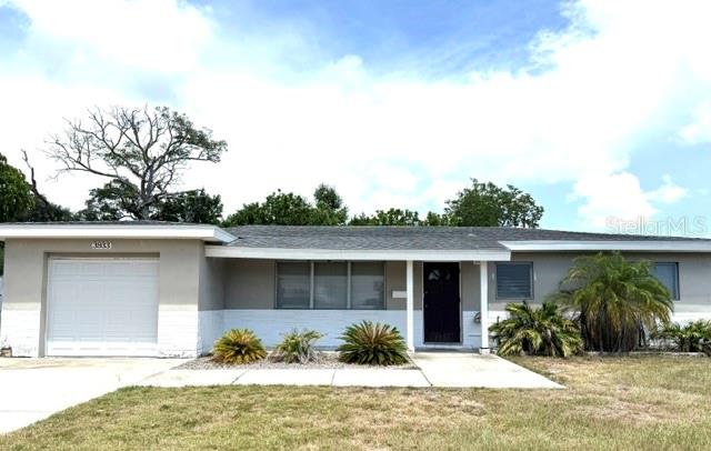 An original owner home! Very well maintained with years of loving memories. You too can make your own wonderful memories here. This three bedroom, one and a half bathroom, one car garage home is located in a high and dry neighborhood with no flood insurance required. You will love the bright shining, easy care terrazzo flooring. As you pass through the living/dining area you will be welcomed by an expansive family room with a wood-burning stone fireplace for chilly evenings. There are three generous size bedrooms with the primary bedroom having its own mini bath. The main bath features vintage tile with modern updates. If you have a hobby or are a gardening enthusiast, the garage has lots of built-in shelving and even a workbench. The considerable size backyard has a covered patio and is large enough for you to add a pool. You will enjoy this Northwest neighborhood close to shopping, restaurants, the beautiful Gulf Beaches, and just a few minutes to the vibrant downtown St. Pete with the Pier, arts, culture, and unique restaurants. Call today to start making your own new memories.