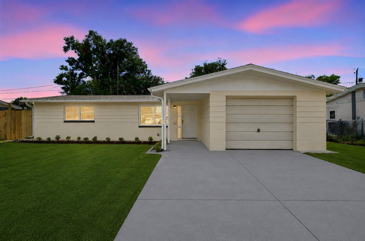 Welcome to this beautifully remodeled, move-in-ready home in the heart of Holiday, Florida! This charming residence offers 3 bedrooms, 2 full bathrooms, and a 1-car garage, all thoughtfully updated with modern finishes throughout. Step inside to a spacious living room featuring a stylish accent wall and luxury vinyl plank flooring that flows throughout the home, offering both durability and easy maintenance. The brand-new kitchen is designed to impress, complete with quartz countertops, breakfast bar, new stainless steel appliances, and plenty of space for cooking and entertaining. Both bathrooms have been completely renovated with new showers, modern vanities, and updated fixtures. Brand new Washer and Dryer are included inside the bathroom.  Additional upgrades include brand new roof, and HVAC, brand-new lighting, new ceiling fans, and fresh interior and exterior paint, giving the home a bright, contemporary feel. Fully fenced backyard, and freshly painted driveways.  Newer windows.  Brand New Roof (2026) and HVAC (2026) Conveniently located just a short drive from shopping, dining, local amenities, beautiful Gulf beaches, and Tampa International Airport, this home offers comfort, style, and an ideal location. Book a showing today, this one won't last long!