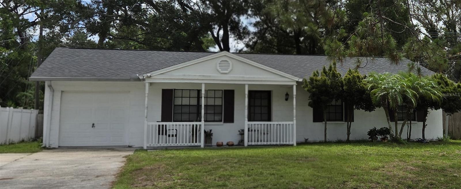 Welcome to 6717 Mornay Circle, a well-maintained 3-bedroom, 1.5-bath concrete block home located in the heart of Town 'N' Country. Major capital improvements have already been completed, including a newer roof, HVAC system, water heater, and updated electrical, providing peace of mind for years to come.

Set back from the street, the home offers a spacious front yard and inviting curb appeal. Inside, you'll find a functional floor plan that lives larger than its square footage, featuring a comfortable living room with a charming brick accent wall, a generous dining area, and a spacious kitchen with abundant cabinet storage and natural light. Durable laminate and tile flooring run throughout the home for easy maintenance.

The primary bedroom includes a private half bath, while the main bathroom features a skylight that fills the space with natural light. All bedrooms have comfortable living space and flexibility for family, guests, or a home office.

Step outside to enjoy the screened rear porch overlooking a large, fully fenced backyard with mature shade trees. Whether entertaining guests, enjoying pets, gardening, or simply relaxing outdoors, the backyard provides plenty of usable space and privacy. Additional features include an attached one-car garage, indoor laundry area, and generous storage.

Conveniently located near Tampa International Airport, the Veterans Expressway, Downtown Tampa, shopping, dining, schools, parks, and major employment centers. No HOA and no CDD fees.

If you're looking for a solid, well-cared-for home with major system updates already completed, this property deserves a place on your must-see list. Schedule your private showing today.