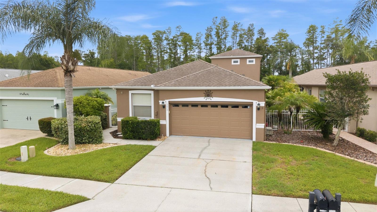 Welcome to your Florida dream home in the highly desirable The Groves Golf & Country Club! This beautifully updated maintenance-free residence offers the perfect combination of comfort, scenic beauty, and an exceptional resort-style lifestyle. Perfectly positioned with tranquil conservation and canal views from the backyard and sweeping golf course views from the front, you'll enjoy peaceful mornings and stunning sunsets every day.

Freshly painted and truly move-in ready, this spacious 3-bedroom, 3-bath home features a flexible floor plan designed for both everyday living and entertaining. The luxurious primary suite and a second bedroom are conveniently located on the main floor, while the private upstairs suite provides the perfect retreat for visiting family and friends, a home office, hobby room, or multigenerational living.

At the heart of the home, the oversized kitchen is sure to impress with abundant cabinetry, generous counter space, a cozy breakfast nook, and a raised breakfast bar where everyone naturally gathers. The open-concept living and dining areas create an inviting atmosphere filled with natural light, making it easy to host holidays, celebrate special occasions, or simply enjoy quiet evenings at home.

But what truly sets this home apart is the lifestyle that comes with it. Living in The Groves Golf & Country Club means enjoying every day like a vacation. Play championship golf, pickleball, or tennis, stay active with fitness classes, or explore countless social opportunities including crafting groups, book clubs, card games, dances, and year-round community events. Don't miss one of the neighborhood's favorite traditions—the monthly $5 Social Committee breakfast, where neighbors become lifelong friends.Even better, your quarterly HOA fee provides exceptional value by covering all exterior maintenance, including lawn care, landscaping, shrubs, mulch, exterior painting, and even the roof. Spend less time on chores and more time enjoying everything this vibrant community has to offer.

Conveniently located near shopping, dining, medical facilities, churches, entertainment, the Veterans Expressway, and I-75, you'll have everything you need just minutes away. Plus, Tampa International Airport is only about 40 minutes away, making travel and visits with family and friends effortless.

Homes offering this combination of location, views, maintenance-free living, and resort-style amenities are rare. Don't miss your opportunity to own one of the finest homes in The Groves. Schedule your private tour today and experience firsthand why so many are proud to call this incredible community home.