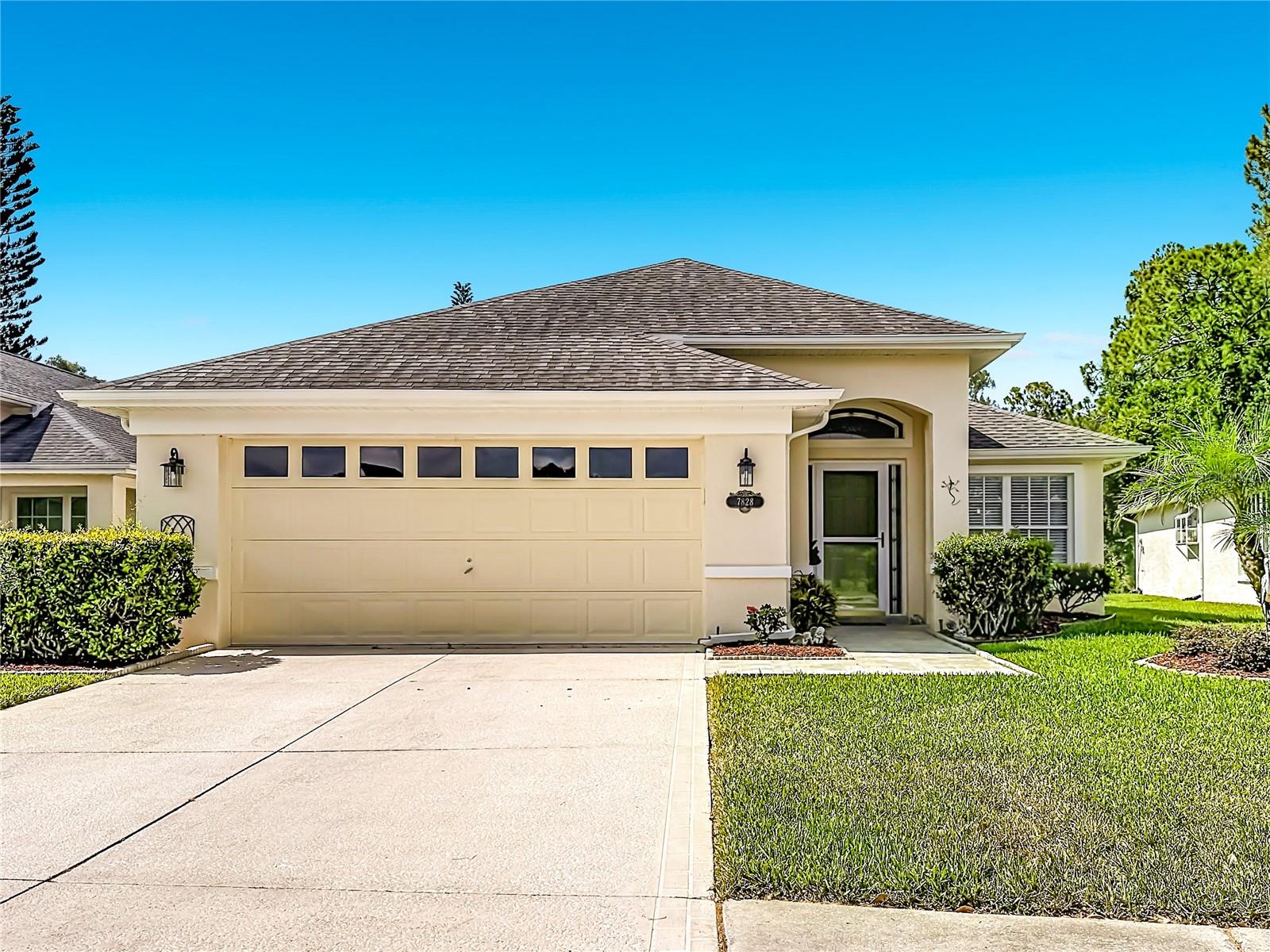 Welcome to this beautifully maintained 3-bedroom, 2-bath home nestled in the desirable gated community of WYNDTREE VILLAGE 11-12. This HOME offers peaceful pond views and a thoughtfully designed open floor plan, this home combines comfort, style, and everyday functionality. The spacious Chef's kitchen is the heart of the home, featuring an oversized center island, abundant countertop space, stainless steel appliances, and an abundance of natural light streaming through numerous windows. Whether you are preparing meals or entertaining guests, this inviting space is sure to impress. Step outside to your private screened lanai overlooking the tranquil pond-an ideal setting for morning coffee, evening relaxation, or creating your own garden oasis filled with colorful flowers and lush landscaping.  Built with durable concrete block construction, this home also offers valuable updates, including a newer HVAC system (2021),a Culligan water softener, and a reverse osmosis water filtration system for added piece of mind. The spacious two car garage provides ample room for vehicles, storage, and hobbies. You will enjoy the Wyndtree community, privacy of a gated entrance and access to a sparkling community pool, all while being conveniently located near shopping, dining, parks, medical facilities, and the beautiful Gulf beaches.  This is an opportunity to own a move in ready home with serene water views in one of the most charming gated communities in the Tampa Bay Area!!!