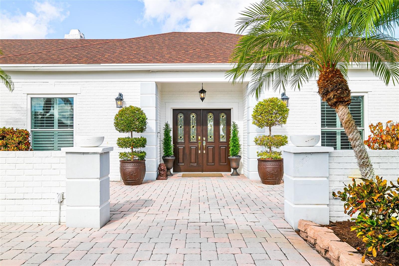 PRICE IMPROVEMENT! Welcome to this exceptional 5 bedroom, 3.5 bath home perfectly positioned at the end of a peaceful cul-de-sac on Bent Tree Golf Club. Designed for both upscale entertaining and comfortable everyday living, this residence offers a rare combination of privacy, elegance, and modern upgrades. Step inside to find formal living and dining rooms, crown molding throughout, and two charming wood-burning fireplaces that add warmth and character. The large designer kitchen features premium finishes, generous counter space, and seamless flow to the main living areas—ideal for gatherings of any size, a full wet bar elevates your hosting experience. The home features a NEW ROOF, NEW POOL CAGE and FULLY PAID SOLAR SYSTEM which provide unmatched efficiency and value for years to come. This smart home also includes a home gym, comprehensive security system, water softener/filtration, and thoughtful upgrades throughout. Outside, enjoy breathtaking sunset views from your private screened lanai and sparkling pool—your own serene retreat overlooking a manicured golf course. A rare opportunity to own a beautifully upgraded, move-in ready home in one of the area’s most sought-after neighborhoods.