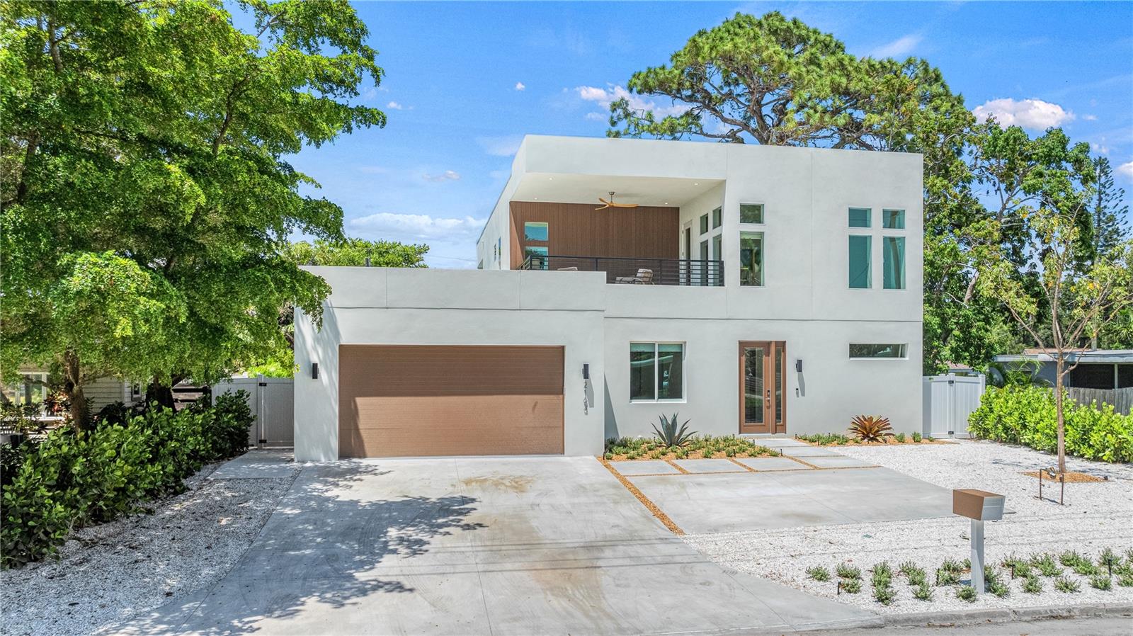 Experience modern Sarasota living at its finest in this stunning five-bedroom, five-and-a-half-bath residence located in the heart of Arlington Park. Designed for style and comfort, this exceptional home offers a bright, open floor plan and a seamless indoor-outdoor lifestyle just minutes from Siesta Key, downtown Sarasota, and St. Armands Circle.

The gourmet kitchen serves as the centerpiece of the home with a spacious island, premium appliances, and contemporary finishes ideal for both daily living and entertaining. The adjoining living and dining areas feature clean lines and abundant natural light, creating an inviting flow throughout the main level.

Each bedroom suite provides generous space and privacy, including four king suites and a flexible fifth suite with a queen and twin bunk—perfect for guests or multi-generational living. Designer bathrooms with custom tilework and upscale fixtures deliver a spa-inspired experience.

The outdoor spaces elevate the property even further with a heated pool and spa, summer kitchen, fireplace, and putting green. A rooftop deck expands the living area with panoramic views and room for sunset gatherings. Additional highlights include a game room, multiple patios, and ample parking.

Set within one of Sarasota’s most convenient neighborhoods, this home combines luxury design, entertainment amenities, and proximity to everything the Gulf Coast has to offer—an ideal choice for a full-time residence, vacation escape, or investment opportunity.