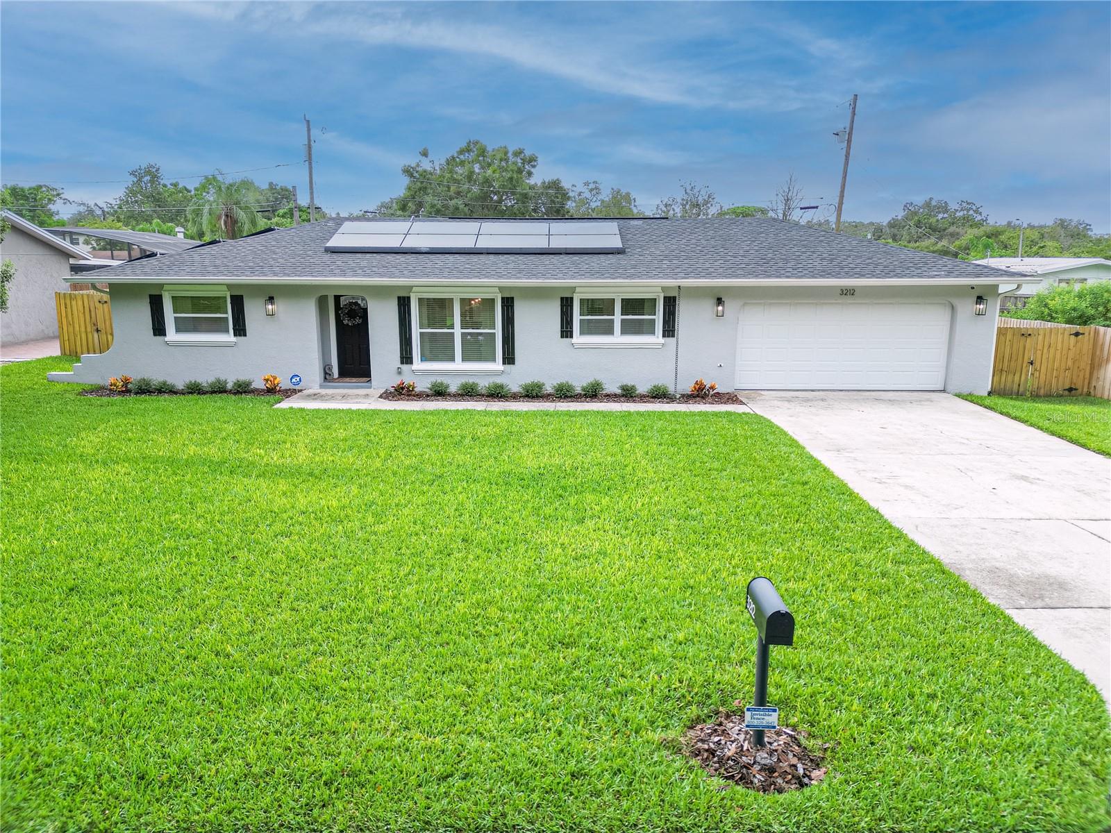 Step into luxury with this completely renovated 3-bedroom, 2-bathroom home, a true masterpiece with NO HOA. The moment you enter, you're greeted by an abundance of natural light, enhancing the spacious and inviting atmosphere. This home boasts modern elegance and eco-friendly living, featuring solar power to reduce your carbon footprint. The brand-new appliances, roof, plumbing, AC unit, irrigation system, garage door, and motor ensure worry-free living for years to come. The meticulously landscaped yard welcomes you to enjoy the outdoors, with a new shed for added storage convenience. Conveniently located, this home provides easy access to Orlando International Airport, Disney attractions, and the vibrant energy of Downtown Orlando.