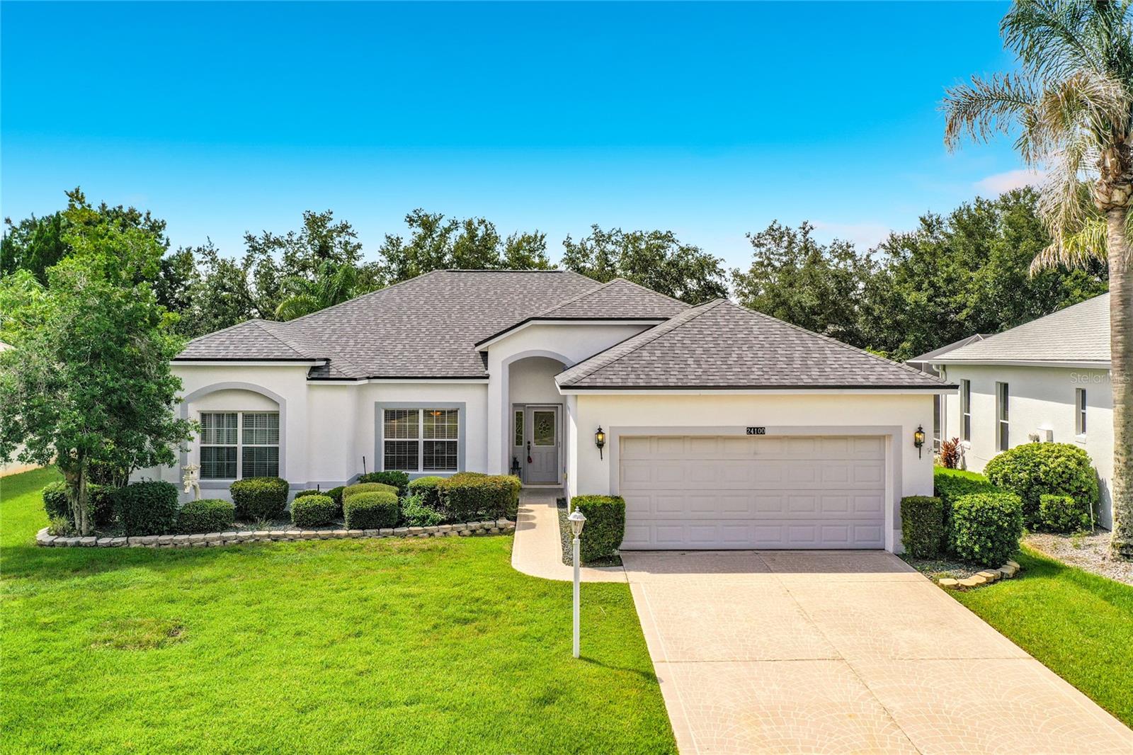 Welcome to this beautifully maintained Hibiscus model, ideally situated in the desirable Brampton Village of Plantation at Leesburg. Designed with a highly sought-after split-bedroom floor plan, this bright and inviting home offers comfort, functionality, and peace of mind with major recent upgrades. Filled with natural light, the spacious interior features neutral flooring throughout, creating a warm and timeless appeal. The well-appointed kitchen offers rich wood cabinetry, stainless steel appliances, a closet pantry, and a charming breakfast nook overlooking the pristine, oversized backyard. The enclosed lanai serves as a wonderful all-season room, perfect for relaxing with your morning coffee,
entertaining guests, or enjoying the beautiful Florida lifestyle year-round. The generous primary suite is a private retreat, complete with dual closets and an ensuite bath featuring dual vanities, a soaking tub, and a separate walk-in shower. On the opposite side of the home are two additional spacious bedrooms, offering excellent privacy for family or guests. (One bedroom currently has the closet removed, providing flexibility for use as an office or hobby room.) Situated on nearly a quarter-acre lot, the home also features an oversized garage
with ample space for vehicles, storage, or a workshop, as well as an indoor laundry room with additional shelving for extra storage. Enjoy the confidence of significant recent improvements, including a new roof (2025), new HVAC system Nov 2024, and new water heater (2026). As an added perk to the buyers , all existing furniture is negotiable, making this truly a move-in-ready opportunity. Don't miss your chance to own this exceptional home in one of Central Florida's premier active adult communities, offering outstanding amenities, beautiful golf courses, and an unmatched lifestyle.The Plantation at Leesburg is a Premier 55+ Active Lifestyle Community. Enjoy leisurely rounds of golf on two beautifully maintained 18-hole championship courses, or stay active on lighted tennis courts perfect for evening matches. Unwind by one of three sparkling pools and Jacuzzis, or embrace a healthy lifestyle with access to world-class fitness centers, volleyball, and pickleball courts. With over 100 planned activities each week, there’s always something exciting to look forward to—whether it’s social gatherings, fitness classes, or hobby clubs. The community is set against a backdrop of scenic, landscaped boulevards and tranquil lakes, offering the perfect setting for fishing, walking, or simply relaxing in nature.Three expansive clubhouses serve as hubs of activity and connection, while an on-site restaurant offers delicious dining just steps from your door. At The Plantation at Leesburg, everything you need to enjoy a vibrant, fulfilling lifestyle and so much more !