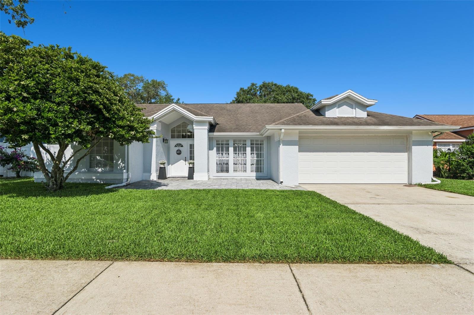 Welcome home to this beautifully updated pool home in the highly sought after Twin Rivers community of Oviedo. Carefully renovated throughout, this residence offers a functional split bedroom floor plan filled with abundant natural light, creating an inviting atmosphere for both everyday living and entertaining.

The heart of the home is the stunning kitchen, remodeled in 2023 with granite countertops, stainless steel appliances, and a generous workspace. The spacious living areas flow seamlessly to the backyard, where you'll discover your own private Florida retreat featuring a sparkling pool, attractive paver hardscape, and a new (2026) vinyl privacy fence, perfect for relaxing weekends, outdoor dining, or entertaining family and friends.

Recent improvements provide added peace of mind, including a newer air conditioning system that has been professionally serviced, a newer water heater, and a spacious two car garage. A dedicated laundry room with a utility sink adds everyday convenience.

Ideally located just minutes from Oviedo on the Park, sought after golf course, the University of Central Florida, shopping, dining, recreation, and nearby Riverside skate park. Combining tasteful updates, exceptional outdoor living, and an outstanding location, this home offers the perfect balance of comfort, convenience, and Florida living.