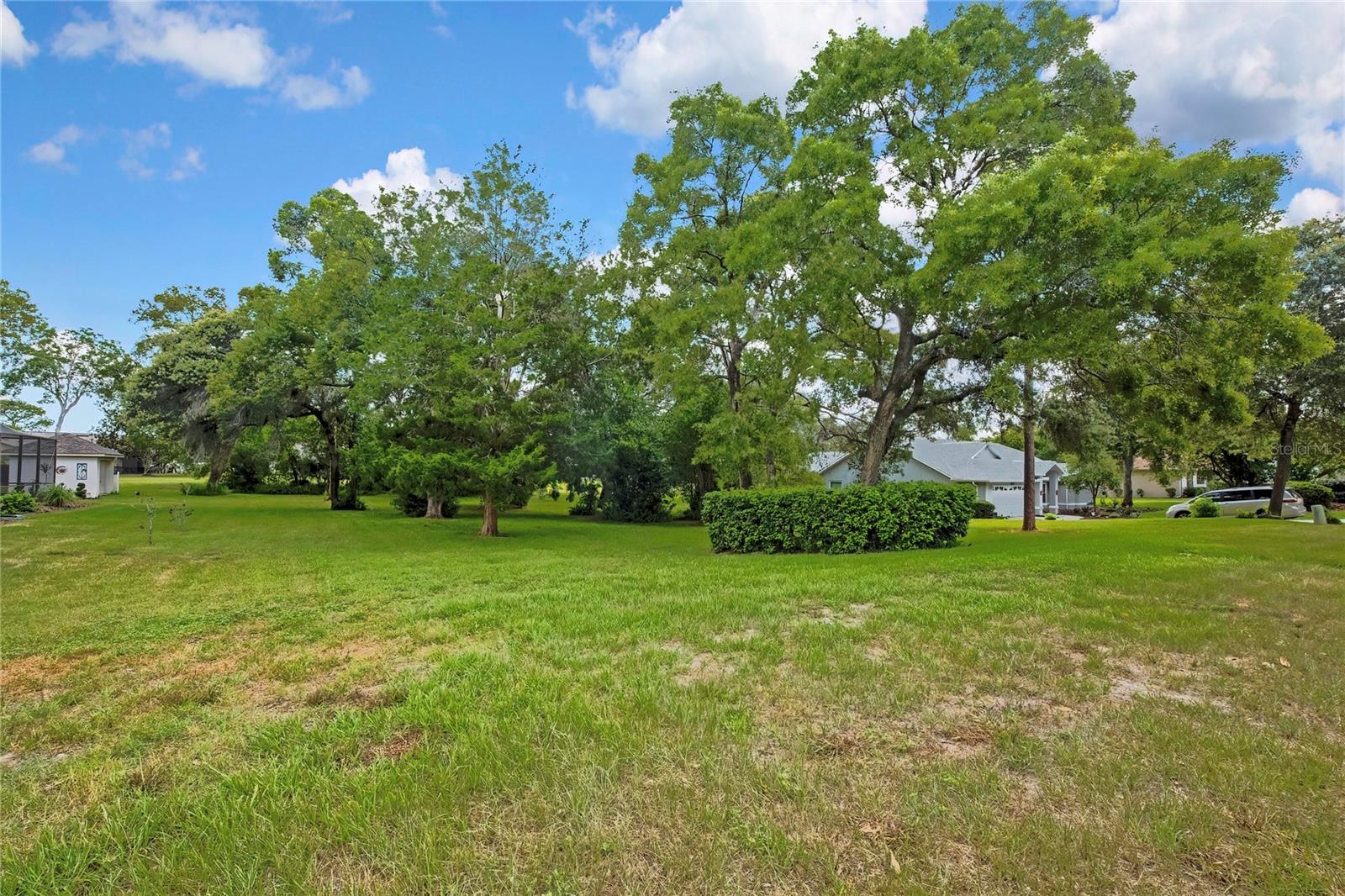 Build your dream home on this beautiful over half-acre homesite located in the highly desirable Rainbow Woods community of Spring Hill. Surrounded by well-maintained custom homes and mature landscaping, this picturesque neighborhood offers the perfect blend of privacy, space, and convenience. With a low HOA of just $150 year, you'll enjoy a peaceful residential setting without high fees.

Rainbow Woods is known for its spacious lots, natural beauty, and pride of ownership throughout the community. Ideally located near shopping, dining, medical facilities, parks, and the Suncoast Parkway, you'll have easy access to Tampa while enjoying the relaxed lifestyle that makes Spring Hill so desirable.

Whether you're ready to build now or planning for the future, this oversized lot provides the perfect opportunity to create the custom home you've always envisioned. Don't miss your chance to own a piece of one of Spring Hill's most sought-after neighborhoods and start building your dream home today!