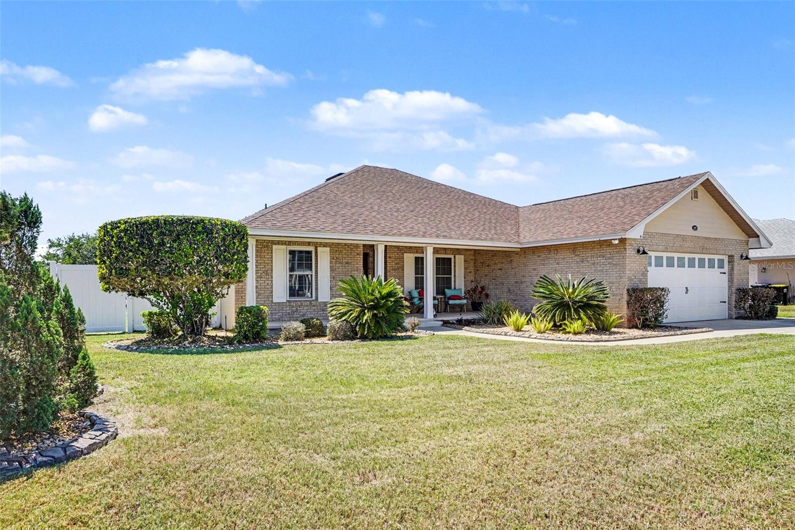 Beautifully maintained 3-bedroom, 2-bath home in the gated community of Shaddock Estates! This move-in ready property features an open floor plan with cathedral ceilings and a spacious layout perfect for everyday living and entertaining. The updated kitchen boasts wood cabinetry, granite countertops, and a stylish subway tile backsplash. Enjoy a large primary suite with walk-in closet and an upgraded bath. Step outside to your private screened-in heated pool and expansive lanai—ideal for relaxing year-round. Additional highlights include a new roof, hurricane windows, updated flooring, and a 2-car garage. Conveniently located near Orlando and Tampa with low HOA fees. Don’t miss this incredible opportunity!