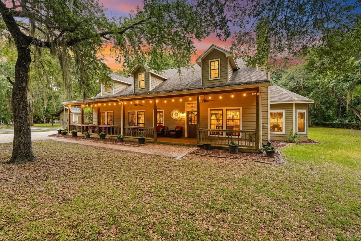 The perfect Geneva home is finally on the market! Located on a paved road and tucked behind a private gate, this exceptionally private 5.69-acre property offers everything you need for country living. Lovingly maintained by its original owners, this 5-bedroom, 3-bathroom home also features two additional flex rooms ideal for a playroom, office, media room, or guest space. Recent updates include a newer roof (2020), upstairs A/C (2018), downstairs A/C (2019), water heater (2019), brand-new luxury vinyl flooring throughout, brand-new impact-resistant windows (2024) with a 15-year warranty, quartz kitchen countertops (2021), newer kitchen appliances (2021), new PEX plumbing (2024), and fresh interior and exterior paint. As you enter through the front gate, you'll appreciate the ample parking, beautiful curb appeal, oversized front porch perfect for relaxing, cozy fire pit area, and detached workshop complete with electricity and A/C. Inside, you'll find abundant natural light, a stunning accent wall, an open-concept kitchen, spacious dining area, laundry room, and all guest bedrooms conveniently located on the first floor. Upstairs features a loft, media room, and private primary suite, along with separate exterior access to the backyard, creating an excellent opportunity for a rental unit, guest quarters, or mother-in-law suite. Located in highly sought-after Seminole County with A-rated schools, this one-of-a-kind estate offers the tranquility of country living while remaining just 15 minutes from Oviedo on the Park, approximately 15 minutes from Orlando Sanford International Airport, and about 45 minutes from Florida's beautiful Atlantic beaches. Don't miss this rare opportunity to have it all!