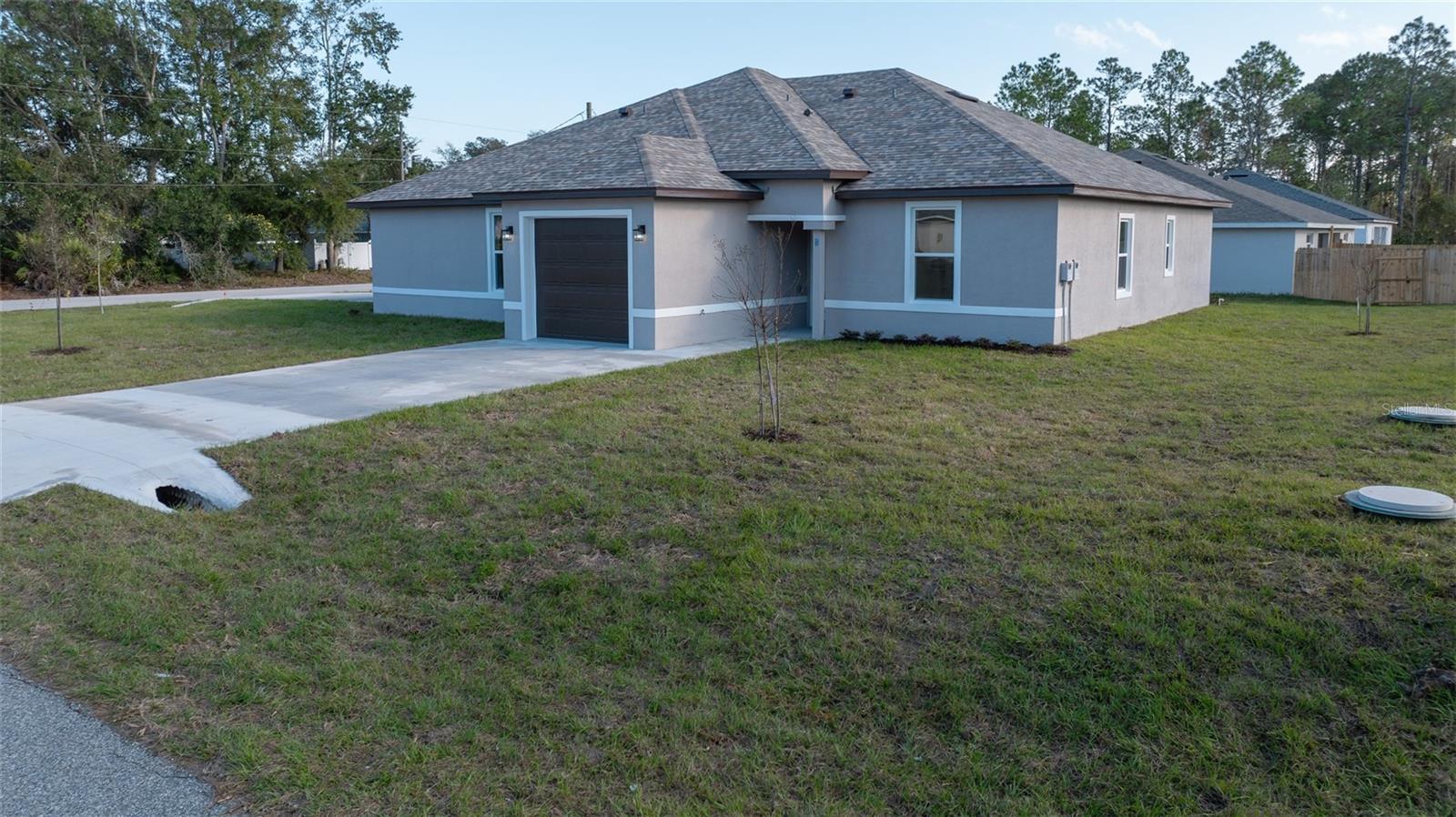 Beautiful Brand New Duplex for rent ! 3 bedrooms , 2 Bath : Many upgrades throughout like 12 ft. Trey ceilings, vinyl waterproof floor ,Tile, upgraded Kitchen with lots of cabinet storage with SS appliances including refrigerator, Quartz countertops, sliding doors with blinds in between to reduce dust, ceiling fans, LED light fixtures, kitchen exhaust fan and more, as well as painted flooring in the garage . Master suite has trey ceiling and walk in closet. Guest rooms have spacious closets and pocket doors. In the Garage you will find access to attic with storage and instant water heater (tankless water heater) . Located close to schools, hospital, Beach, US-1 (straight route to Daytona Beach) and many of our local favorite restaurants! Photos of actual property. Property will be fully fenced with a divider in June.