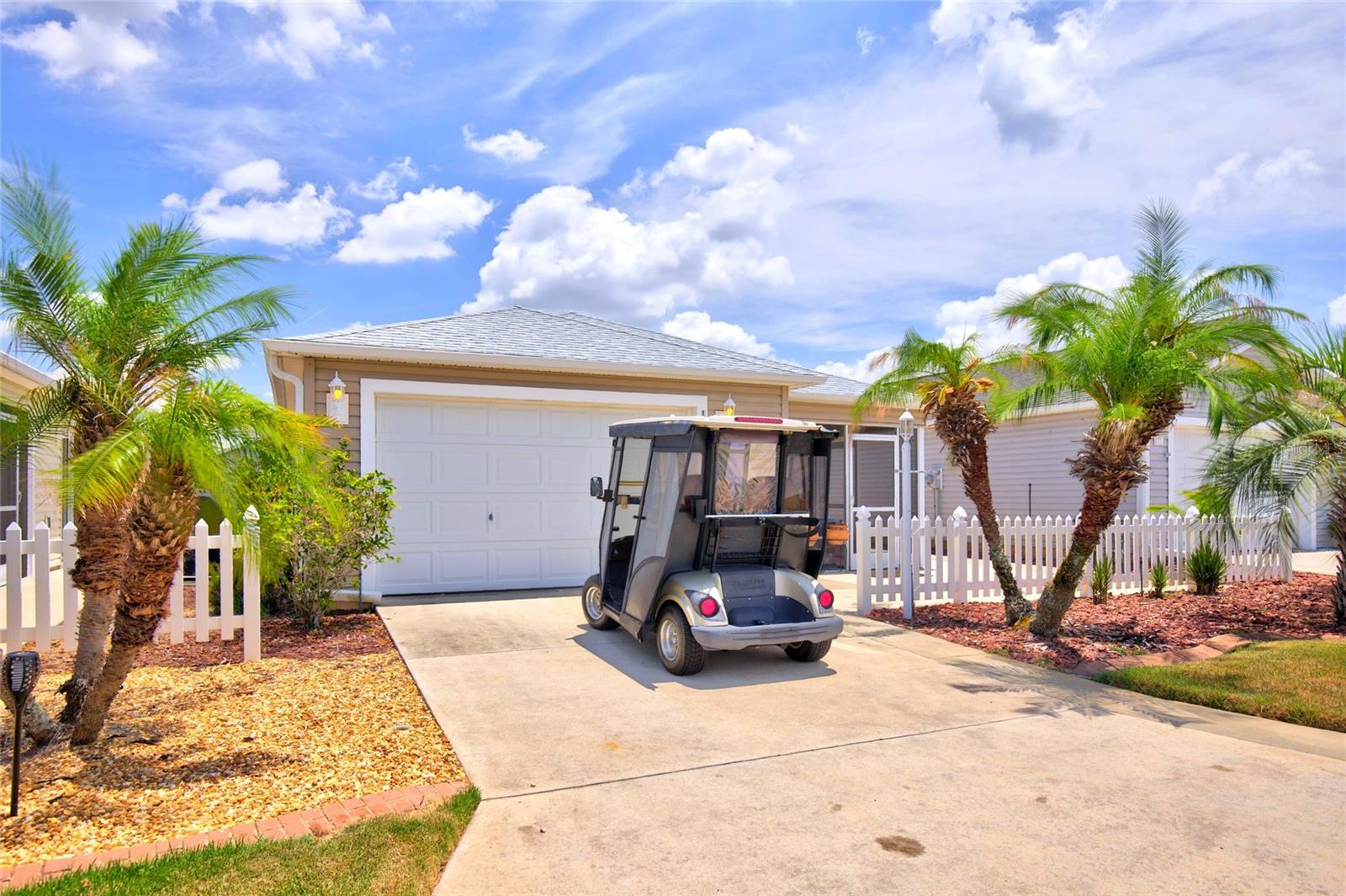 TURN KEY - FULLY FURNISHED HOME  WITH GOLF CART INCLUDED!! LOCATED IN THE VILLAGES OF SUMTER PLACIDA VILLAS...NEW 2026 ROOF IN THIS TURN KEY HOME HAS COVERED AND SCREENED IN FRONT PORCH/LANAI WITH TILE FLOORS AND AN EXTENDED CONCRETE PATIO. THE FRONT DOOR LEADS INTO A OPEN FULLY FURNISHED OPEN FLOOR PLAN WITH LUXURY VINYL PLANK FLOORING ( NO CARPET) DINING AREA, LIVING ROOM AND KITCHEN. THE KITCHEN FEATURES A BAR TOP ISLAND WITH ROOM FOR BAR STOOLS AND BREAKFAST AREA. THE KITCHEN SINK OVERLOOKS THE LIVING ROOM. THE GARAGE IS SPACIOUS AND IS THE HOME TO THE WASHER AND DRYER AND GOLF CART (INCLUDED). DOWN THE HALL FROM THE LIVING ROOM IS THE 2ND BATH AND 2ND BEDROOM. iN FAR RIGHT CORNER OF HOME IS THE OWNERS RETREAT AND PRIMARY BATH FEATURING SLIDING GLASS DOOR, WALK IN SHOWER. 2012 HVAC WITH SOFT START. 2012 HOT WATER HEATER. COME ENJOY ALL THAT THE VILLAGES AND THE SUNSHINE STATE HAS TO EXPLORE AT AN INCREDIBLE PRICE. EASILY A GREAT AIRBNB OPPORTUNITY AWAITS!