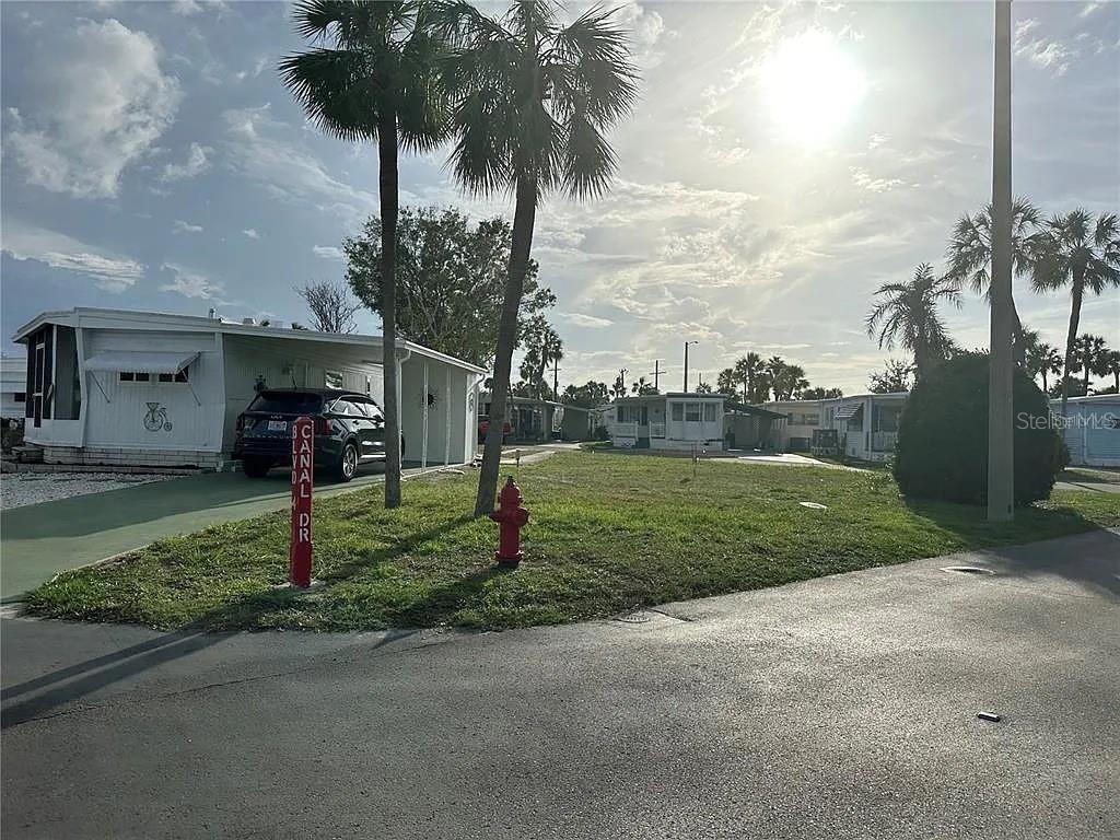 Regency Cove vacant corner lot ready for your dream home!  Enjoy the good life in this 55+ waterfront gated community in South Tampa on Tampa Bay.  No lot rental fee, resident-owned community.  Site plan available for an approved home.  All information and measurements provided are deemed reliable, not guaranteed, and should be independently verified by the buyer.