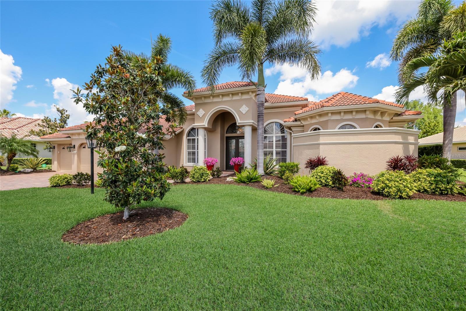 Positioned on a premium lake and golf course homesite within the prestigious Lakewood Ranch Country Club, this beautifully updated 3,152-square-foot residence combines picturesque views with exceptional quality and peace of mind, featuring a new roof (2023,) whole-house generator, and two brand new HVAC systems. Designed to embrace the Florida lifestyle, pocketing sliders from the primary suite, kitchen, living room, and bonus room beautifully unite the indoor and outdoor living spaces, opening to an expansive lanai with clear-view screens, a resurfaced pool with new pool equipment, and a spacious outdoor kitchen overlooking the stunning lake and golf course setting. Offering 3 bedrooms, 3 baths, a private office with double-door entry and built-ins, and a versatile bonus room, the home is enhanced by engineered hardwood flooring throughout, coffered ceilings, custom woodwork, plantation shutters, landscape lighting, and a 3-car garage with built-in storage. The open kitchen is designed for both everyday living and entertaining, featuring a breakfast bar, prep island, gas cooktop, and seamless connection to the great room, while the living room is anchored by a gas fireplace. The spa-inspired primary suite offers dual vanities, a soaking tub, walk-through shower with courtyard window, and custom closets, while all secondary bedrooms also feature custom closet systems. A water filtration system further enhances this exceptional Lakewood Ranch Country Club residence. Lakewood Ranch is the number one best-selling, multigenerational community in the country and located near world-class shopping, dining, entertainment and is minutes to I-75, beaches, great schools and medical facilities. Several membership levels to the Lakewood Ranch Golf and Country Club are available and are optional.
