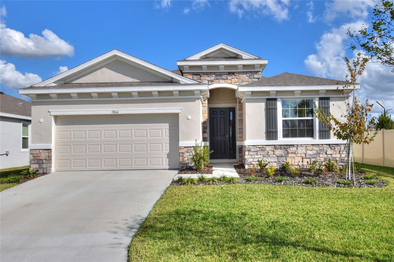 TAKING BACKUP OFFERS! Welcome to your dream home in the heart of North Park Isle, Plant City! This BETTER THAN NEW meticulously maintained 4-bedroom, 2 and Half-bathroom gem offers the perfect blend of modern comforts and timeless charm. Boasting a spacious 2-car garage and situated in this truly wonderful community, this residence is a genuine Florida haven. Step inside and be greeted by an open-concept living space, featuring abundant natural light and stylish finishes throughout. The well-appointed kitchen is a chef's delight, complete with granite countertops, stainless steel appliances, and ample cabinet space. Whether you're entertaining guests or enjoying a quiet evening in, this home provides the perfect backdrop for making lasting memories. The master suite is a true retreat, offering a sanctuary of relaxation with its generous proportions and an ensuite bathroom that includes dual vanities and a luxurious soaking tub. Two additional bedrooms provide flexibility for guests, a home office, or a growing family. Step outside to discover your own private oasis. The backyard is an ideal space for outdoor gatherings, barbecues, or simply unwinding after a long day. Plus, enjoy the perks of the vibrant North Park Isle community, including a clubhouse, pool, playground, pickle ball courts, and basketball court. North Park Isle's amazing community amenities and proximity to local parks and schools make this location very central. Conveniently located near the interstate, shopping, medical, restaurants and much more this home provides easy access to everything Plant City has to offer while offering a tranquil escape from the hustle and bustle. Don't miss the opportunity to make this house your home – schedule a showing today and start envisioning your future in North Park Isle!