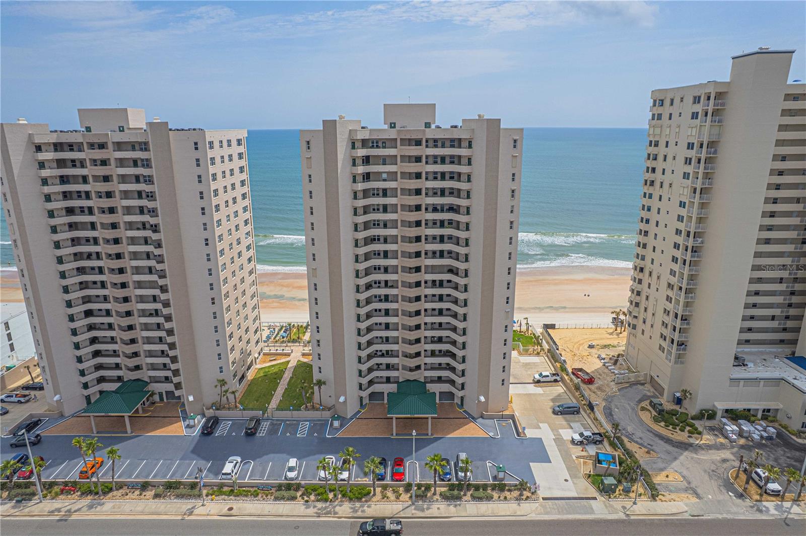 Experience breathtaking, unobstructed panoramic views of both the ocean and river from this 17th-floor 2-bedroom, 2-bath luxury condo at the prestigious Dimucci Twin Towers. Wake up to glorious sunrises from your private oceanfront balcony and unwind with exotic sunsets from the west-facing bonus room. ***The kitchen features granite countertops and comes fully equipped with everything you need. The oceanfront primary suite offers the ultimate in relaxation with a jetted Jacuzzi tub, separate shower, dual vanities, and granite counters. Tile flooring runs throughout the unit, with new luxury vinyl flooring in the primary suite for added comfort. ***This desirable building allows 2-week minimum rentals, making it ideal for generating extra income when not in use as your full-time residence. ***Building amenities include: Secure underground parking, State-of-the-art security systems, two oceanfront swimming pools and two hot tubs on a spacious sun deck,