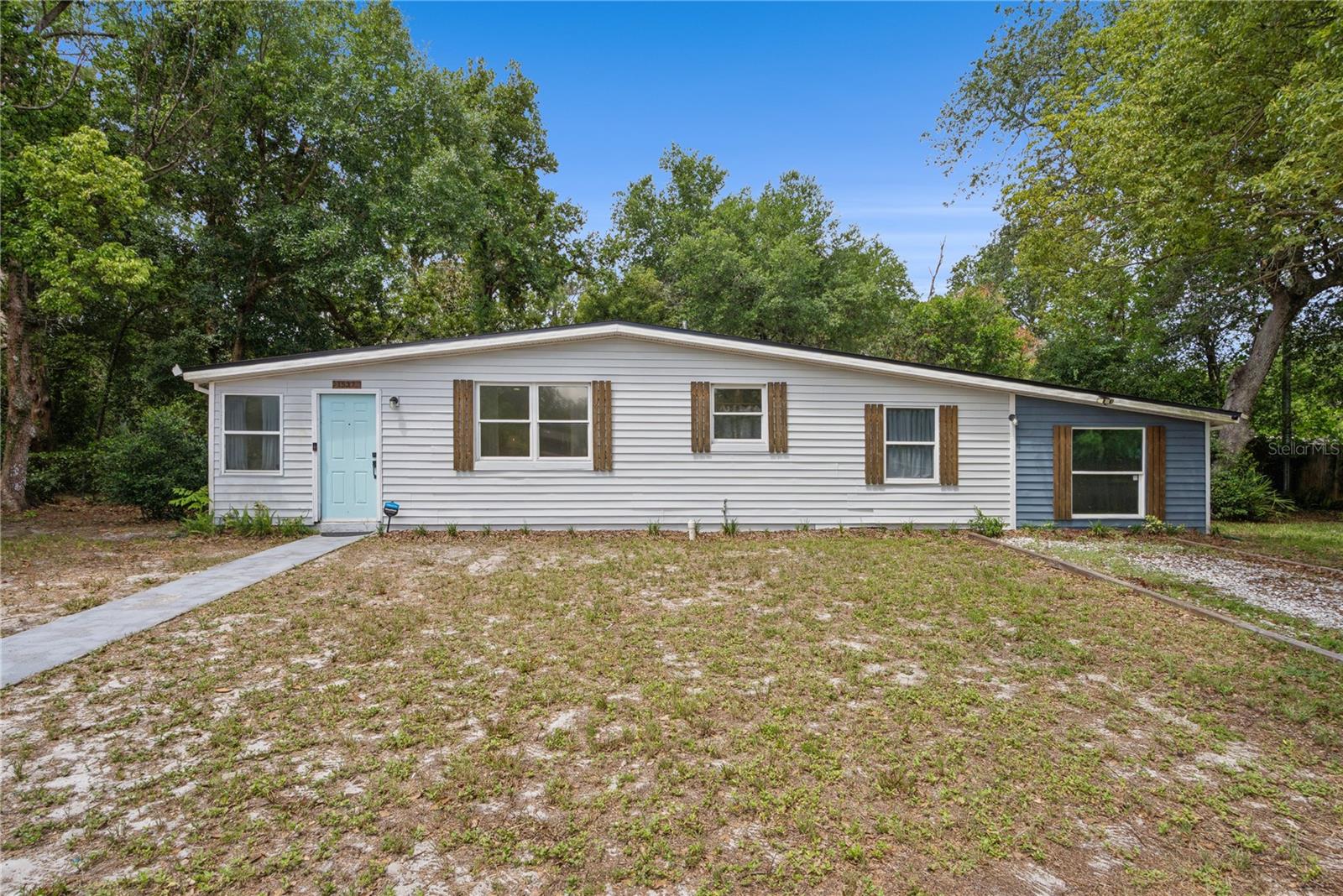 Move in ready 4-bedroom, 2-bath home tucked away on a quiet cul-de-sac in Deltona Lakes! Renovated  in 2022, this home offers a great combination of modern finishes, convenience, and privacy. The kitchen was updated with quartz countertops, a stylish backsplash, stainless steel appliances, updated cabinetry, and contemporary finishes. Additional improvements completed in 2022 include updated bathrooms, modern tile and laminate flooring throughout, interior and exterior paint, updated light fixtures, and an upgraded A/C system and hot water heater. The spacious layout provides comfortable living for families, first time home buyers, or anyone looking for a well-maintained home with thoughtful updates already in place. Conveniently located just minutes from shopping, restaurants, schools, and everyday conveniences, with quick access to I-4 for an easy commute to Orlando, Daytona Beach, and surrounding areas. Enjoy the peace and quiet of cul-de-sac living while still being close to everything you need. This is a great opportunity to own an updated home in one of Deltona’s most convenient locations.