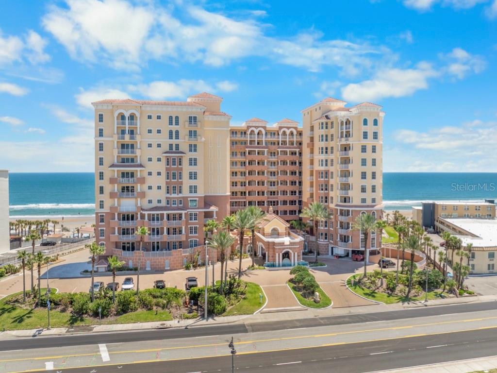 Enter this BEAUTIFUL CORNER 3BR/3BA COASTAL RETREAT through the IMPRESSIVE GRAND ENTRY FOYER with ELEGANT TRAY CEILING!! Your eyes immediately focus on the LIGHT & BRIGHT OPEN FLOOR PLAN with an ABUNDANCE OF NATURAL LIGHT and awesome views of the AZURE ATLANTIC OCEAN!! This magnificent residence boasts a DESIRABLE SPLIT BEDROOM FLOOR PLAN with a total of 3,098 SQ. FT. of luxurious coastal living area including FOUR (4) PRIVATE BALCONIES, WALK-IN CLOSETS & ABUNDANT STORAGE SPACE!! An EXPANSIVE GREAT ROOM has generous space, an ELECTRIC FIREPLACE and BEAUTIFUL OCEAN VIEWS!! The chef's FULLY-EQUIPPED GOURMET KITCHEN features Bosche & Thermadore stainless steel appliances, granite countertops, wood cabinetry, a center island, large pantry & access to a PRIVATE BALCONY WITH BUILT-IN GRILL!! The THREE SIZABLE EN-SUITE BEDROOMS each with PRIVATE BALCONY embrace the ultimate beachfront lifestyle!! Wake up to stunning ocean views & glorious sunrises from the EXPANSIVE PRIMARY SUITE featuring a PRIVATE WRAP AROUND BALCONY and beautifully designed SPA-INSPIRED BATHROOM. Your family & guests wlll enjoy TWO COMFORTABLE EN-SUITE GUEST BEDROOMS each with a PRIVATE BALCONY offering maximum comfort & privacy!! This awesome condo has been well-maintained and rarely occupied. Some furnishings included. RESORT STYLE AMENITIES include a sparkling heated pool & hot tub, state-of-the-art fitness center, exquisite club/social room, fire pits, high speed elevators & newly decorated lobby, making this condo the perfect choice for your signature residence!! EXPERT MANAGEMENT and NO PENDING ASSESSMENTS reflects long-term financial strength and stability. Contact us today for a personal tour of this oceanfront showplace!!