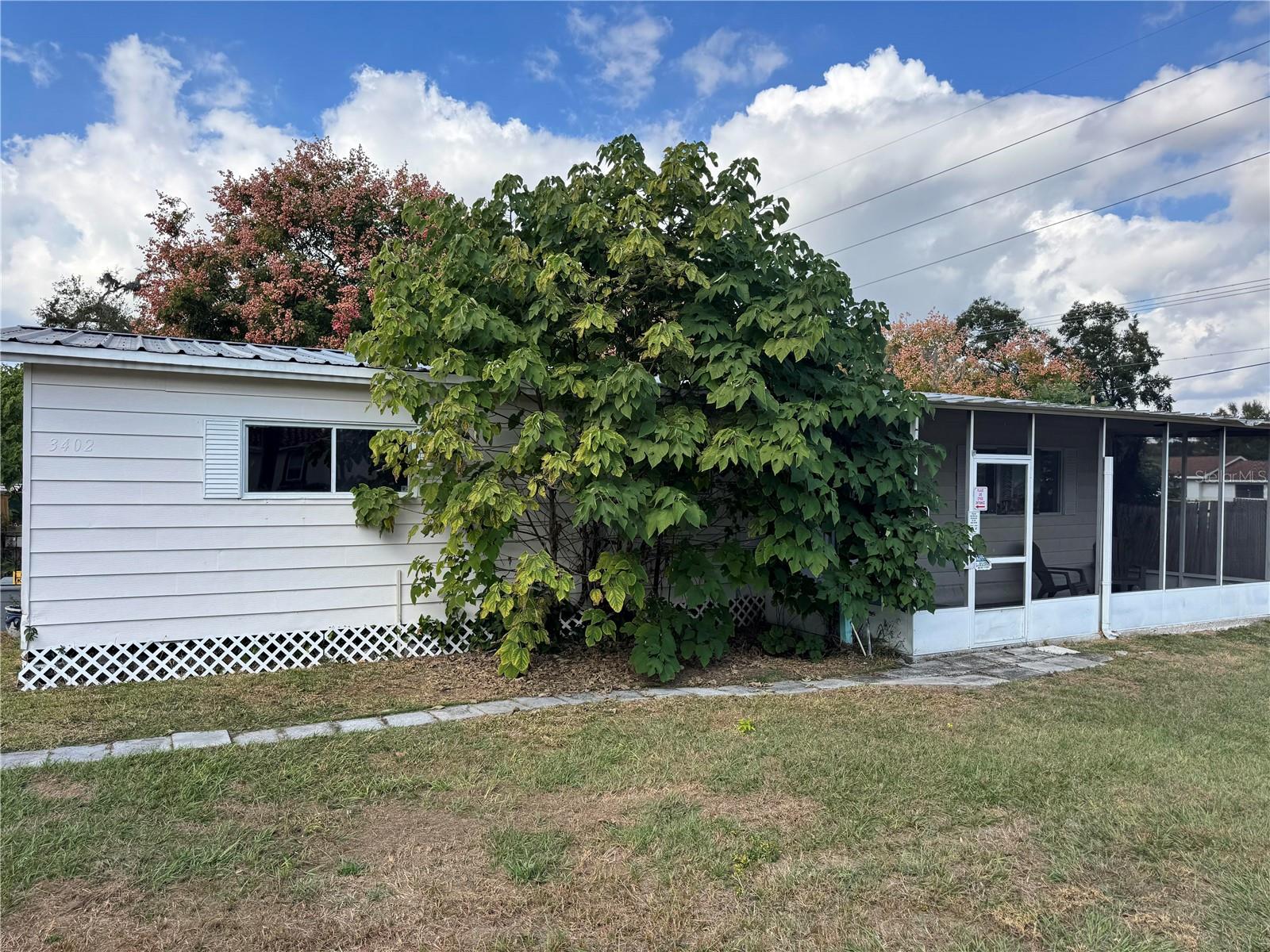 Discover peaceful, country-style living just minutes from Tampa at 3402 Pearson Road. This charming 2-bedroom, 2-bath manufactured home sits on an expansive 0.62-acre lot, offering rare space and privacy in a highly desirable Valrico location.
Key Features
Open Concept Living: The home’s layout features an open living area that seamlessly connects to the kitchen—ideal for relaxed everyday living or entertaining.
Spacious Bedrooms: A generous primary bedroom and a well-sized second bedroom provide comfort and flexibility.
Durable Upgrades: Vinyl plank (LVP) flooring throughout the home ensures both style and easy maintenance.
Enclosed Lanai: Enjoy an indoor-outdoor space that can serve as a sunroom, additional seating area, or play space.
Modern Roof: The property boasts a metal roof installed just four years ago, giving peace of mind when it comes to durability.
No HOA: With no homeowners association fees, you have the freedom to make this property truly your own.
Needs some care.....