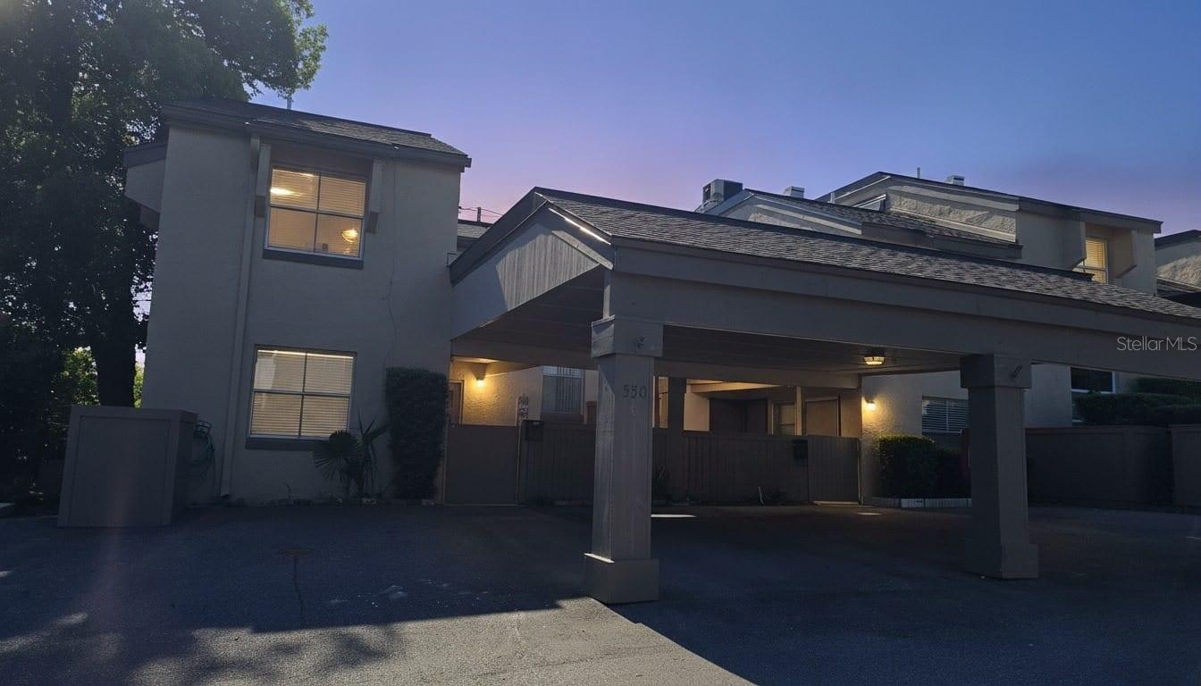 Welcome home to this beautifully updated two-bedroom, two and a half-bath 55+ condo community in the heart of Altamonte Springs! This light-filled residence features cathedral ceilings and an abundance of windows that create an open, airy atmosphere throughout. The stunning remodeled kitchen is the heart of the home, showcasing elegant granite countertops, stainless steel appliances, and plenty of cabinet space for both everyday living and entertaining. Both bathrooms have also been tastefully updated, offering modern finishes and a fresh, contemporary feel. The main living areas feature easy-care tile flooring, while the bedrooms have plush carpeting. Enjoy your morning coffee or unwind in the spacious enclosed lanai/Florida room, providing additional living space to enjoy year-round. Additional conveniences include an inside laundry area, a covered carport, and a charming courtyard setting. Residents also enjoy access to a community clubhouse and sparkling swimming pool. Ideally located just moments from shopping, dining, and everyday conveniences, this home also offers the unique benefit of a private gated pedestrian entrance with keyed access to the nearby hospital—perfect for healthcare professionals or anyone seeking exceptional convenience. Whether you're looking for a primary residence, a seasonal retreat, or an investment opportunity, this move-in-ready condo offers comfort, style, and an unbeatable Altamonte Springs location.