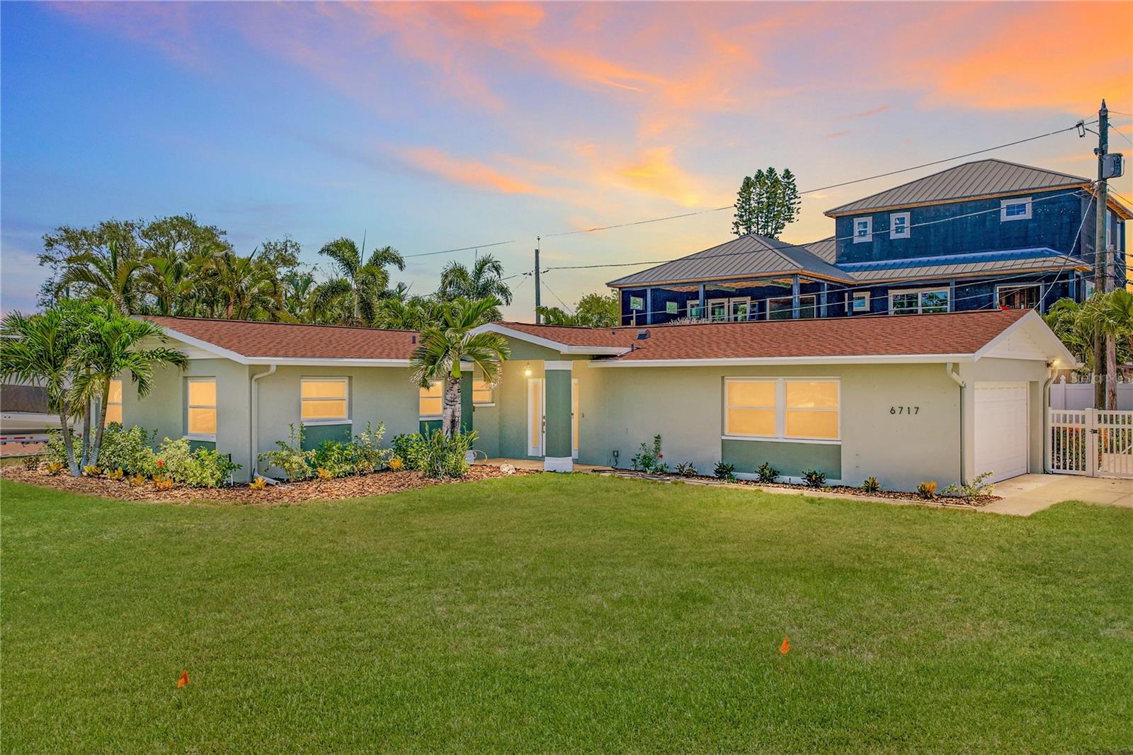 A rare opportunity has arrived in the highly sought-after waterfront community of Pasadena Golf Club Estates. Perfectly blending timeless design, modern efficiency, and exceptional versatility, this completely reimagined residence offers 4 bedrooms, a dedicated office, 3 bathrooms, and a 2-car garage. All thoughtfully designed for today's lifestyle.

One of the home's most exceptional features is its two private primary suites, a rare and highly desirable offering that provides incredible flexibility for multi-generational living, accommodating guests, or creating the ultimate owner's retreat.

Inside, you'll find a spacious and inviting floor plan featuring both a large living room and an additional family room, providing ample space for entertaining and everyday living. The home is finished in a timeless neutral color palette and complemented by luxury vinyl plank flooring throughout, creating a cohesive and sophisticated aesthetic.

At the heart of the home is a beautifully appointed chef's kitchen with crisp white cabinetry, a contrasting dark-toned island, elegant quartz countertops, and an oversized walk-in pantry that offers exceptional storage.

Step outside to enjoy the fenced backyard, offering privacy and plenty of room to relax, entertain, or create your own outdoor oasis.

What truly sets this home apart is its incredible energy efficiency. Equipped with fully paid-off solar panels and an EV charging station, the current owners enjoy an average electric bill of approximately $30 per month—an exceptional benefit that seamlessly combines luxury living with modern sustainability.

Adding even more appeal, this property is located in unincorporated Pinellas County, creating a rare opportunity for short-term rental potential and investment flexibility.

Completely renovated and truly move-in ready, this is your opportunity to own a beautifully updated home with a two car garage and ample parking space, in one of St. Petersburg's most desirable neighborhoods, just moments from the beach, premier dining, and everything that makes the Florida lifestyle so special.