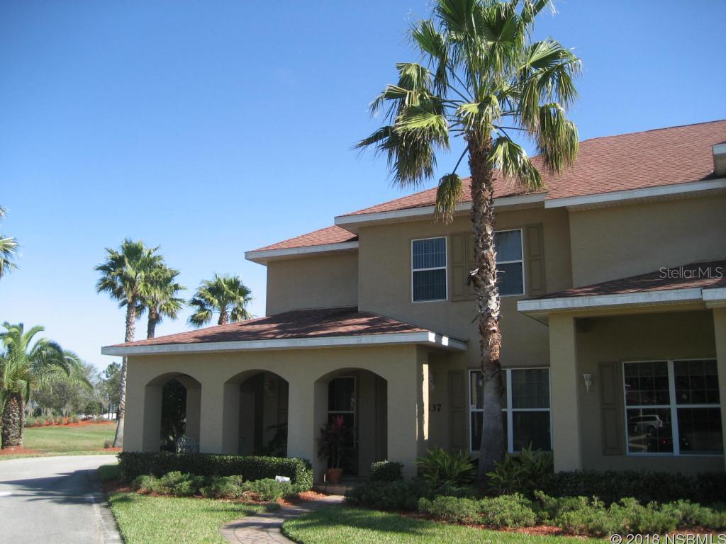 Enjoy a Carefree Lifestyle in a "Maintenance Free" Parkside Townhome in Beautiful Venetian Bay!  This Cambridge Model has  a Fantastic Lake View from your Wrap-Around Front Porch.  An Immaculate & Private End Unit features: 2 Master Suites Upstairs, 2.5 baths and 2 Car Garage, Laundry room with Sink, Window Treatments, Fans, Carpet & Tile. Beautifully Landscaped with Brick Pavers on Porch, Walkway, Driveway and Patio. Venetian Bay is one of New Smyrna Beach's Exclusive Development with an 18-hole Golf Course, Golf Clubhouse, Walk or Bike Nature Preserve & Trails, Restaurant, Day Spa & More! Pet Friendly Too!  (Additional Venetian Bay HOA Master Ass. $800 Annually.)  Offered "AS IS", All information is assumed to be accurate, but not guaranteed. ;Water: City