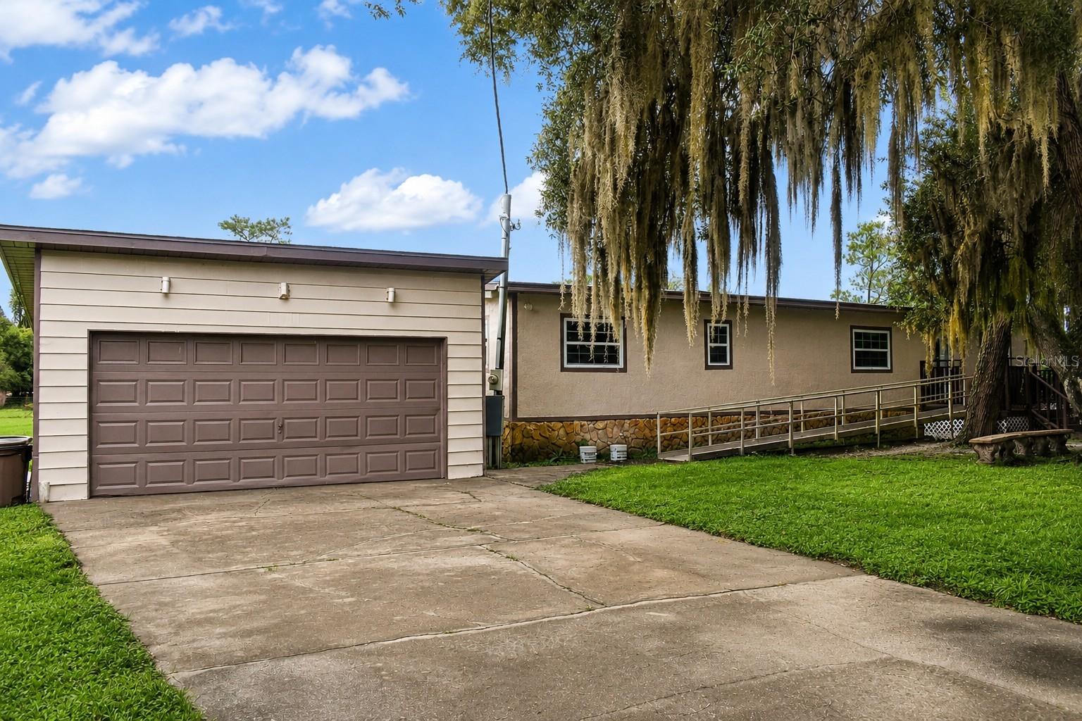 Tastefully remodeled from top to bottom. Close to the World Equestrian Center. Short drive to all of Ocala's amenities through the HWY 200 corridor. Easy commute to I-75. This home has been upgraded throughout. Flooring, kitchen, bathrooms, electrical panel, windows, doors all done in 2021. Freshly painted in and out. Has a detached garage. The home also has a wheelchair ramp. The property has 2 functional wells with water filtration system. Comes with a storage shed. Property has one paddock with two stalls with electricity. Property being offer with 3.75 acres. Property is completely fenced. Bring your farm animals, zoned A-1 on a paved road corner lot. Easy to show.