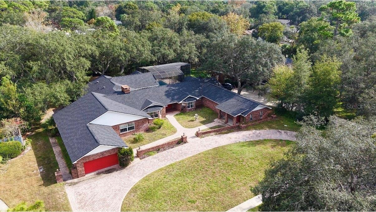 Short Sale. Motivated Seller! Welcome to this beautiful WATERFRONT 5 Bed/ 3Bath Home with BRAND NEW ROOF and at 1.26 Acre Lot on Sweatwater Creek. With close to 6500 square footage, this house provide spacious and comfortable living space. House also features separate dining room, extra office/flex room, and upstair loft. Car garage can fit in around 6 cars and Circular paver driveway provide plenty of space for parking and easy access to the main road. This house features a lot of luxury custom designs, especially in kitchen and ding areas. The state-of-the-art kitchen has been completely remodeled with all new custom cabinets and fully equipped with all Viking, high-end stainless-steel appliances, including a professional 6 burner gas cook top with double ovens, a professional series hood, an additional wall oven, 2 dishwashers, a wine refrigerator, microwave and two sub-zero refrigerators. Dining room that overlook the screen swimming pool and backyard is stunning with all custom cabinets and solid stone counter table. Dive in the extra long swimming pool and relax and cool with friend and family in summer heat or spend quality time at the spacious outdoor living area with peaceful water views of the natural creek and landscaping. This breathtaking home is nested in sought-after Sweetwater Community that has access to a community dock, playground, tennis courts and beautiful Lake Brantley. Make this beautiful home yours. Schedule a private showing today and make this beautiful home your new residence... Matterport 3D tour are available on Zillow and MLS for virtual tour and provide room measurements.