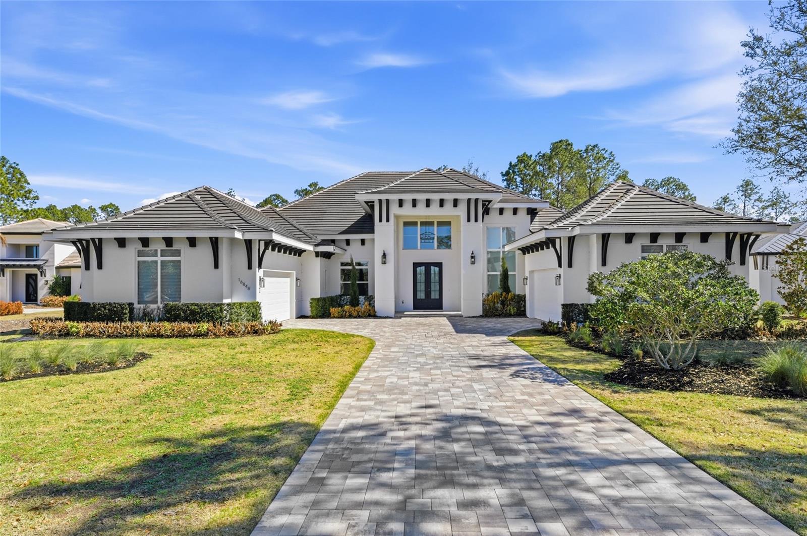 Presenting an extraordinary estate within the exclusive gated community of Bella Collina, one of Central Florida’s most prestigious and sought-after addresses. Set on an impressive 5,000+ square meter (over 1.2-acre) homesite, this fully single-story residence offers elegance, privacy, and a true resort-style lifestyle.

The home features 5 spacious suites, each with its own walk-in closet, 5 full bathrooms, and 1 half bath. One of the suites has been thoughtfully designed and customized as a private fitness studio, providing convenience and exclusivity for daily wellness and training within the comfort of your own home. For enhanced security and peace of mind, the residence is equipped with hurricane-impact doors, offering superior protection and durability.

The primary suite is a serene retreat, showcasing a spa-inspired bathroom with a soaking tub, dual showers, dual vanities, an expansive walk-in closet, and refined finishes throughout. Wood-look ceramic flooring adds warmth and sophistication to the space.

The main living areas impress with an open-concept design that flows effortlessly. The gourmet kitchen is both spacious and refined, featuring custom wood cabinetry, stainless steel appliances, quartz countertops, and a grand center island that seamlessly integrates with the living and dining areas — ideal for entertaining with style and ease.

Large sliding glass doors invite abundant natural light and open to a spectacular outdoor living space. Designed for unforgettable gatherings and everyday enjoyment, the exterior features a fully equipped summer kitchen, playground area, basketball court, and a private heated pool with an integrated spa — your own personal oasis.

Living in Bella Collina means embracing an unparalleled lifestyle. Residents enjoy access to The Club at Bella Collina, offering a championship golf course, tennis and pickleball courts, a resort-style pool complex, state-of-the-art fitness center, luxury spa, fine dining, and a vibrant social calendar.

The location is simply exceptional. Just minutes from the charming downtown of Winter Garden — known for its boutiques, cafés, acclaimed restaurants, and the popular Farmers Market — the property also provides convenient access to the Florida Turnpike and State Road 429, ensuring effortless travel to Orlando, world-famous theme parks, and major airports. Additionally, it is near the renowned Montverde Academy, recognized nationally for its academic excellence.

Curtains located in the master bedroom and main living room are not included in the sale.

This is more than a home — it is an invitation to experience exclusivity, sophistication, and an elevated quality of life.

Don’t miss the opportunity to make this extraordinary address your new residence.