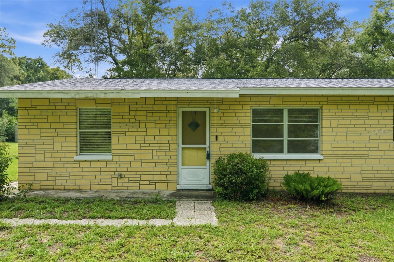 Escape to 2.43 private, wooded acres in Inverness with NO HOA and room to roam! This solid 3-bedroom, 2-bath concrete block home offers easy single-story living with tile flooring throughout, central heat and air, and a full appliance package that stays. A welcoming circular drive and mature shade trees set the tone, while acreage gives you space to add a pool, build a workshop, park the RV or boat, garden, or simply enjoy the peace and quiet. Situated in flood zone X and on a paved county road, yet convenient to shopping, dining, medical, and the natural beauty Citrus County is known for. Bring your vision - this one has the land and the bones to make it your own.