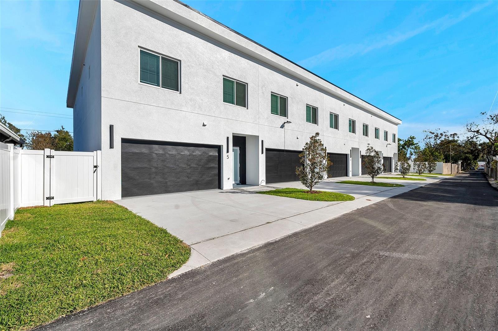 Multiple offers received. Highest and best due! All units are now complete. Act now to secure this luxury new construction Multifamily project with No HOA fees or reserves required with ownership of all 5 townhome units! Additionally, this property sits in an opportunity zone positioned for long term TAX SAVINGS for the right investor.(No capital gains after 10 years of ownership*) Introducing West Tampa Luxury Townhomes, all units are same size 3/2.5/2 where elegance meets convenience located in the heart of booming West Tampa. This exclusive offering is ideal for an active or passive investor seeking an option to purchase FIVE Brand new block construction townhomes together. Yes, own the entire building, your chance to invest in a brand new maintenance free community with no lease or pet restrictions, if desired! New owner(s) has the ability to finalize HOA bylaws to allow short term or long term rentals and other restrictions including fees. These two story solid block construction residences, complete with hurricane impact windows, sliders, and doors, and a 50 year Metal roof are ideal for Florida’s inclement weather and guarantee low insurance hazard premiums to combat high insurance rates. NO FLOOD INSRUANCE needed! No recent storm damage with prior hurricanes. The chic modern finishes that embody contemporary living, showcasing an open floor plan seamlessly fusing kitchen, dining, and living spaces on the ground floor. The kitchen boasts quartz countertops, solid wood high gloss cabinets, and a large open space for hosting, effortlessly blending style with functionality. Distinguished by 10-4’-foot ceiling heights, a half bath, large 2 car garage, front in the rear alley access with enough room for 4 cars to park. The second floor features the massive primary bedroom with its own custom built huge walk-in closet, an en-suite bathroom adorned with high-level finishes, including a generous walk-in shower and dual vanities. Two additional bedrooms offer versatility for guest quarters, a home office, or personalized use shared by another full bathroom. The laundry room is conveniently located next to the bedrooms, with linin storage closet, and a nice size wet bar for entertainment. Each townhome includes it’s own power and water meter plus a master water meter for HOA irrigation system. Each townhome has its own 2 car garage and private driveway in the back. There is a total of 2273sqft living sqft per townhome for a combined sqft of 13,273sqft under roof. Located in West Tampa minutes from downtown Tampa, Riverside heights, Armature works, South Tampa, Buccaneer stadium, UT, more This is a true MAINTENANCE FREE INVESTMENT opportunity where the community HOA will pressure wash the buildings for owners, maintain the landscaping common area, and paint the buildings for your future tenants. Since all units are individually deeded and metered for own utilities as single family Townhomes, an individual could acquire with residential financing, commercial financing, or portfolio loan. please do not walk or drive on the property without written permission. Shown by appointment only. Schedule an appointment to tour. information in this listing should be verified by buyer(s) and buyer’s agents independently.