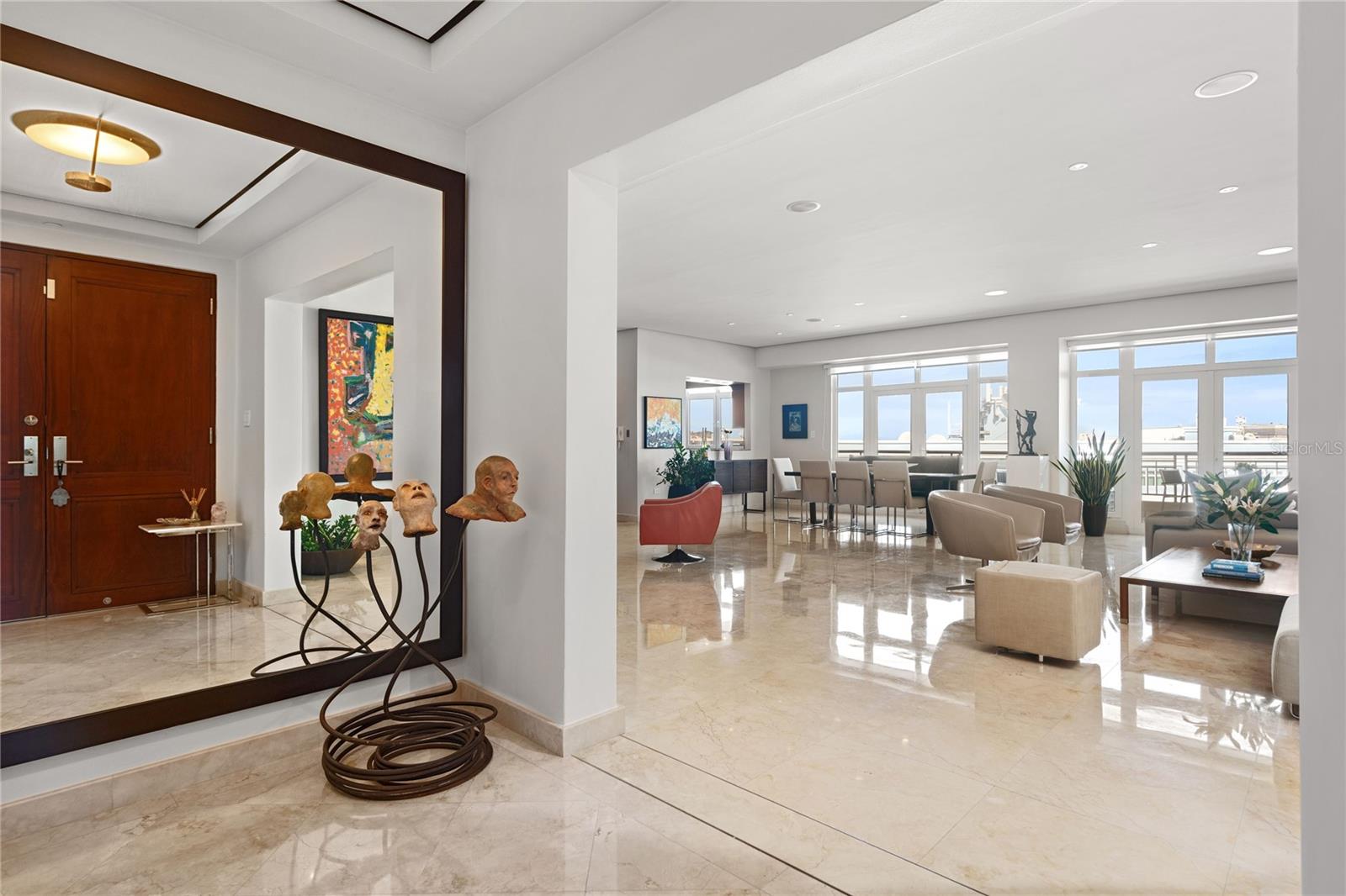 Harbor Plaza, the newest residential building in Old San Juan, San Juan’s oldest neighborhood, offers an unparalleled waterfront lifestyle. This resplendent corner Penthouse stands as one of merely five elite Penthouses within this boutique building of only 35 residences.  Alluringly spacious with 3,553 sq.ft. and ceilings that are over 11 feet high, featuring three generously sized bedrooms all with ensuite bathrooms.

The grandeur of high ceilings enfolds you in an air of sophistication.  High-quality Sienna-toned marble floors guide you through the foyer towards the grand living area, a space meticulously curated where every detail has been selected with discerning taste.  This exclusive corner Penthouse boasts a magnificent northeastern exposure ensuring an abundance of natural light, bathing the interior in a soft glow that complements the lavish furnishings. Panoramic views of the San Juan Bay Harbor and the historic Old San Juan Cityscape serve as a living masterpiece, painting an ever-changing tableau that transcends ordinary living. 

Four large covered parking spaces and a convenient storage unit complements the practicality of this residence.  Situated on the harborfront in the Historic District of Old San Juan, every step outside leads to the vibrant tapestry of the city, where history and modernity dance in perfect harmony. With easy in-and-out access, every amenity and cultural gem is at your doorstep, making this unique Penthouse a symphony of exclusivity, elegance and convenience.