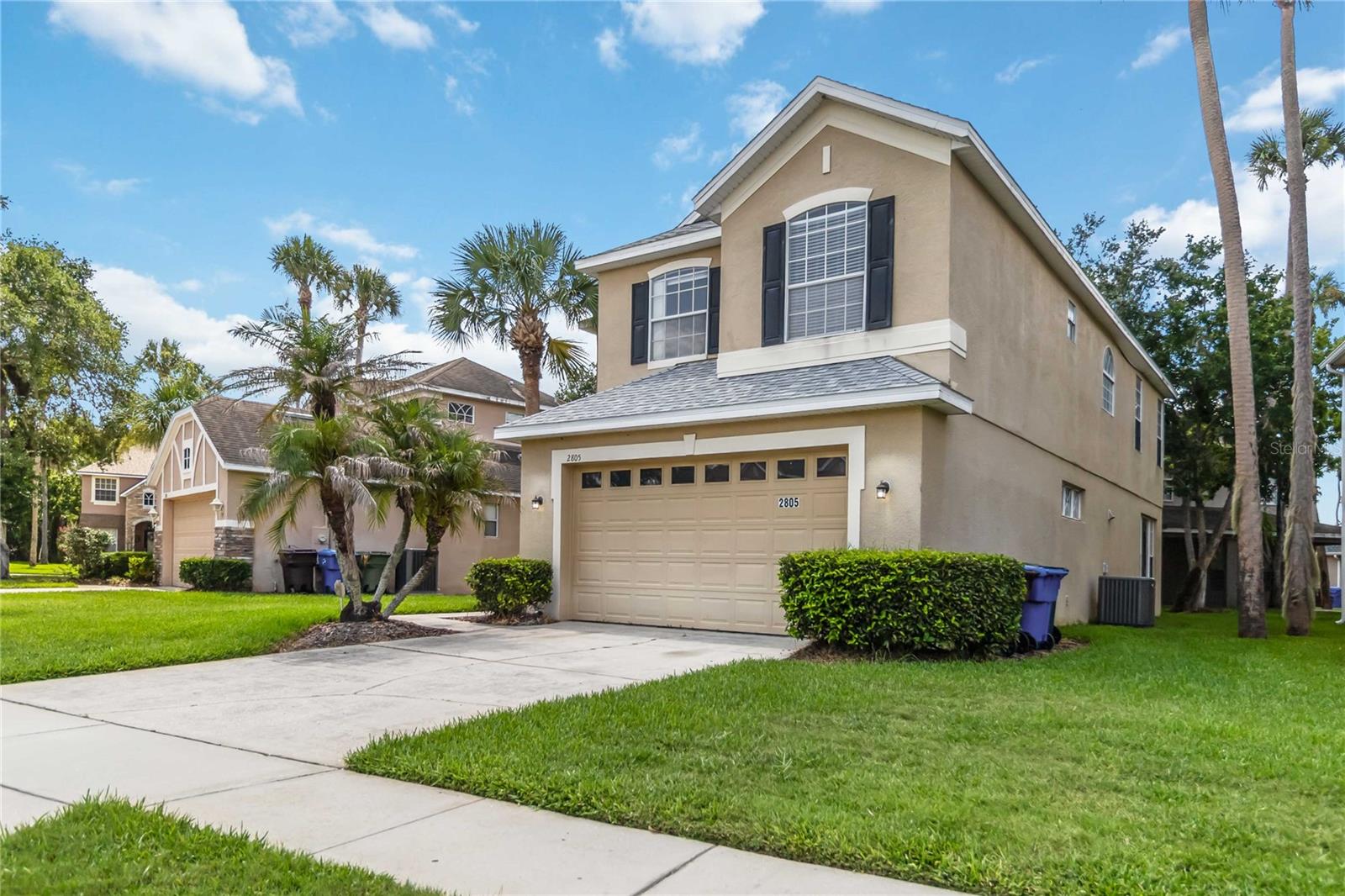 Welcome to this beautifully maintained home located in the gated Eagles Nest of The Oaks Golf Community. Featuring soaring 20-foot ceilings and abundant natural light, the spacious living area creates an open and inviting atmosphere. The well-appointed kitchen offers stainless steel appliances, 42-inch cabinetry, Corian countertops with an integrated sink, a breakfast bar, and ample storage space. A separate dining area is conveniently situated adjacent to the kitchen, making entertaining easy.

The upstairs primary suite provides a private retreat with dual vanities, a garden tub, separate shower, and a large walk-in closet. The original loft has been professionally enclosed with permits, creating an additional bedroom that adds valuable living space and flexibility for family, guests, or a private retreat.

Step outside to enjoy the covered and screened lanai, perfect for relaxing year-round. HOA dues include lawn and landscape maintenance, gated entry, and maintenance of common areas, allowing for a truly low-maintenance lifestyle.

Ideally located near major highways, shopping, dining, schools, golf, and Central Florida's world-famous attractions. This traditional sale presents an excellent opportunity to own in one of Kissimmee's most desirable gated golf communities. Don't miss your chance to make this beautiful home yours!