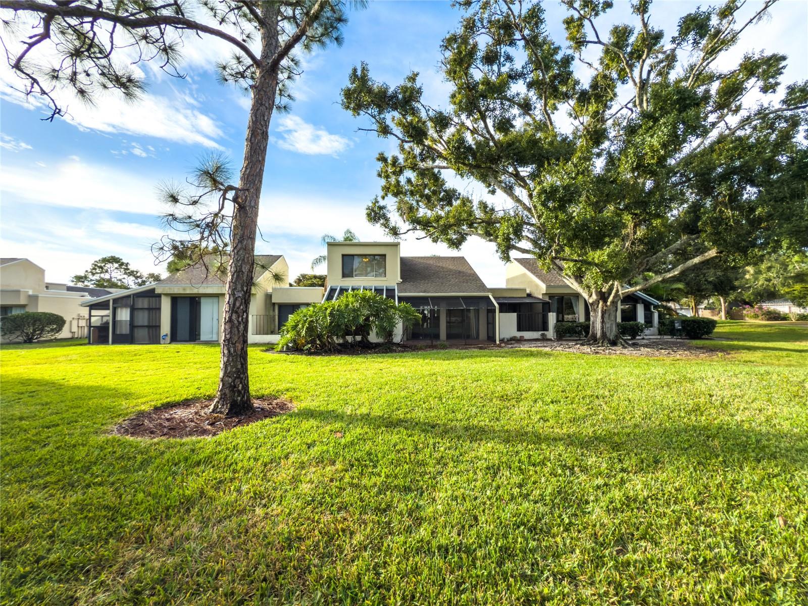 Amazing lake views! Check out the incredible amenities as well-tennis, pickleball, water aerobics, tai chi, yoga and more! Located just steps from the golf course, this rare and private three-bedroom, two bathroom townhouse is nestled in the highly sought-after community of The Meadows of Sarasota, just south of Benderson Park and UTC.   Newer roof  in 2023, community pool and access to other great amenities make this community exceptional. Come enjoy living in the most beautiful community for walking and biking paths in Sarasota. This two-story residence offers the convenience of main-level living with all essential amenities, including the laundry room located downstairs, providing an ideal layout for those who prefer fewer stairs while maintaining privacy for guests upstairs. The home features a spacious screened lanai with an extended paver patio out the back sliding glass doors, perfect for outdoor dining or relaxing beneath the shade of a mature oak tree. Constructed of durable concrete block, this villa offers a truly maintenance-free lifestyle, with exterior and yard maintenance handled by the HOA. Residents enjoy close proximity to the community pool and clubhouse, along with access to fitness facilities, social activities, walking and biking trails, green spaces, and optional golf, tennis, and pickleball through country club membership. Conveniently located near downtown Sarasota, UTC shopping and dining, I-75, and Sarasota’s renowned beaches, this 1,560-square-foot property is an exceptional opportunity not to be missed.