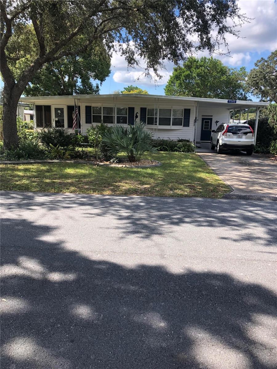 Calling all investors, tenant in place for the last 5 years and wants to continue with lease and prefers to renew at renewal time.  No missed/late payments!  This quiet, friendly 55+ golf community is highly desirable and a great retirement investment opportunity for someone wanting income from day one of ownership.  Property is not leased; property is owned.  Heat pump was replaced in 2025 and home has been meticulously maintained inside and out.  The Florida room is large and comfortable with exit to front property and the fenced back yard. Covered parking for both your car and golf cart. Family room is huge and open to dining area.  Both bedrooms are very large and roomy with built in closets.  Main bedroom has a full bath with second bath centrally located for convenience.  Community offers, tennis, heated pool, golf and community events with a low HOA.
