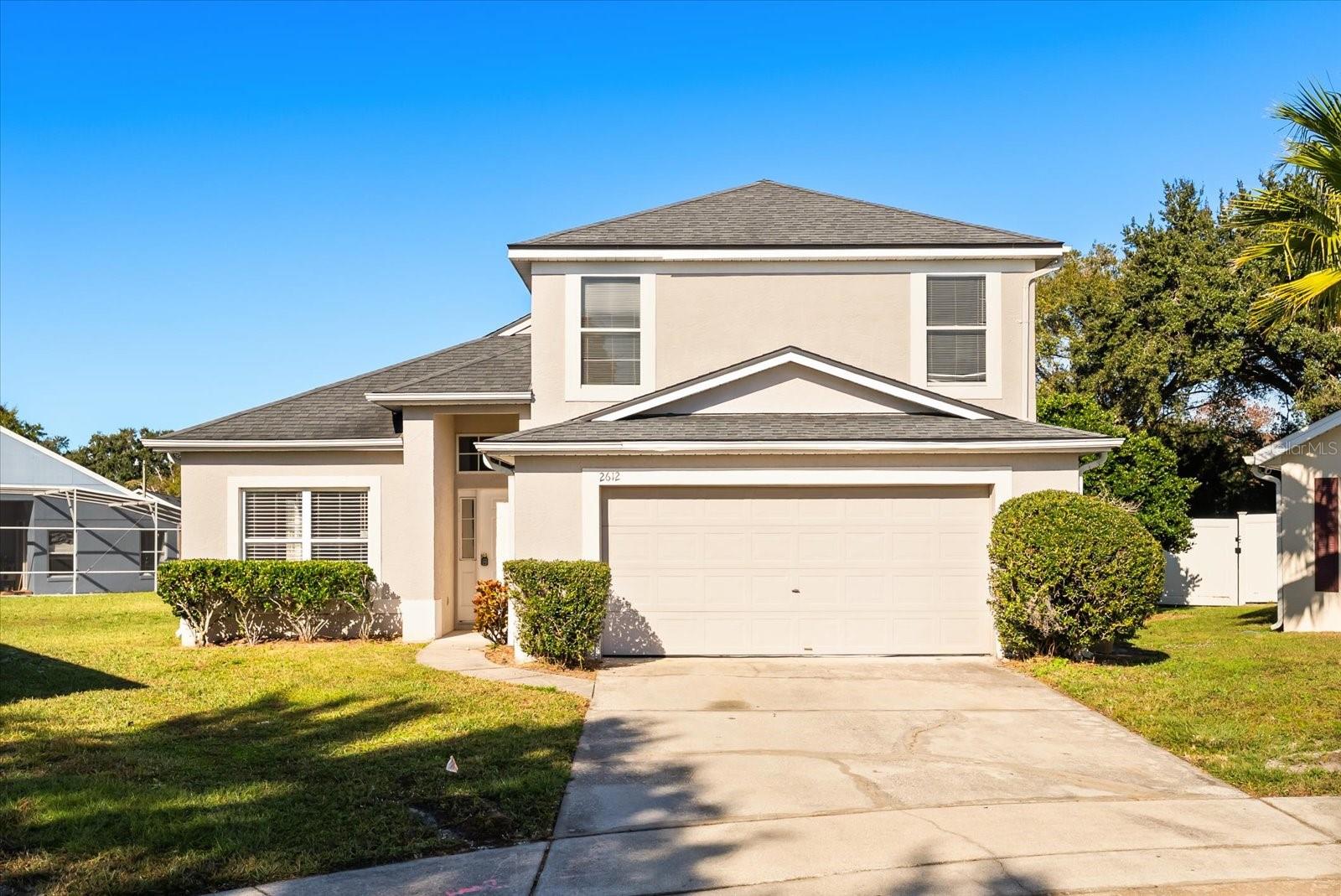 Virtually Staged. Welcome to 2612 Brookshire Court, a spacious 4-bedroom, 2.5-bath pool home tucked away on a quiet cul-de-sac in Kissimmee. Featuring new modern vinyl flooring, bright open living spaces, and a desirable first-floor primary suite, this home offers a comfortable and flexible layout with plenty of room to spread out.

The main living areas are filled with natural light and provide multiple spaces for relaxing, dining, entertaining, or working from home. The primary bedroom is conveniently located on the first floor, offering added privacy and easy access, while the additional bedrooms are located upstairs.

Step outside to enjoy your own private screened-in pool and covered patio, perfect for outdoor dining, weekend gatherings, or simply relaxing and enjoying the Florida lifestyle. Both professional lawn care and pool service are included in the rent, allowing you to enjoy the outdoor spaces without the added maintenance.

Located near shopping, dining, schools, major roadways, and Central Florida attractions, this home combines space, convenience, and low-maintenance living in a peaceful cul-de-sac setting. Available for its next long-term tenant.