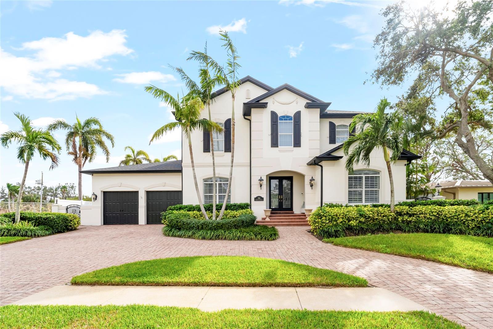GOLF COURSE HOME IN SNELL ISLE WITH WATER VIEWS OVERLOOKING THE 16TH HOLE OF THE VINOY GOLF COURSE, ELEVATED CONSTRUCTION, POOL, OUTDOOR KITCHEN, AND UPDATED ROOF AND SYSTEMS
Located in the Snell Isle neighborhood of St Petersburg, this 4 bedroom, 4.5 bath home offers 4,267 heated square feet and a layout designed for both everyday living and entertaining. The property overlooks the 16th hole of the Vinoy Golf Course with a tranquil water view between the backyard and fairway, creating privacy and open sightlines without direct rear neighbors.
Built in 2001 with an elevation of 8.3 feet, the home offers a balance of location, quality construction, and livability in one of St. Pete’s most established neighborhoods. The main living areas are centered around the kitchen and family room, creating a natural gathering space with a wood-burning fireplace and 2 sets of sliding doors that open to the covered patio and pool area.
The kitchen is designed for both function and entertaining with double islands, quartz countertops, custom cabinetry, a closet pantry, coffee bar, and appliances updated in 2019. A butler’s pantry connects the kitchen to the dining room, enhancing flow for hosting and everyday use.
The home also includes a private home office and a dedicated media room. The primary suite offers a spacious layout with a sitting area and private balcony overlooking the pool and golf course. The primary bathroom was remodeled in 2023 and features a soaking tub, walk-in shower, dual vanities, and a large walk-in closet.
Interior features include real hardwood floors throughout, refinished in 2023, 10 foot ceilings, 8 foot solid wood doors, and crown molding throughout.
Outdoor living is designed for year-round enjoyment with an open-air pool area, covered patio, and an outdoor kitchen with gas grill and beverage refrigerator. The pool was resurfaced with new equipment in 2017. The backyard opens to the golf course and water feature, providing expansive views and a sense of space.
Additional updates include a roof replaced in 2021, water heater in 2022, seawall and cap completed around 2017, and double-pane windows. HVAC system installed in 2015. Additional features include a Tesla charger, water softener, and an oversized two-car garage.
Snell Isle offers convenient access to downtown St Petersburg, waterfront parks, marinas, dining, and the Vinoy Golf Club, with proximity to Tampa Bay and surrounding amenities.