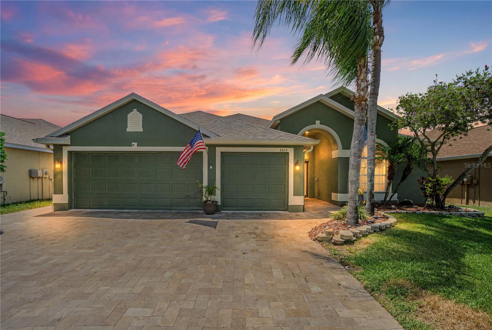 Welcome to Key Vista, one of Holiday's most desirable communities! This spacious 4-bedroom, 3-bathroom pool home offers over 2,400 square feet of living space, a 3-car garage, and a floor plan designed for both comfortable living and effortless entertaining. When you step inside, you'll find a formal living and dining area, perfect for hosting family gatherings and special occasions. Continue through the home to the heart of the house, where the open kitchen overlooks a spacious family room, creating a bright and inviting space for everyday living. The primary suite features two walk-in closets and a private bath with dual sinks, a garden tub, separate shower, and water closet. One of the home's standout features is its thoughtfully designed three-way split floor plan. Two bedrooms and a full bath are located toward the front of the home, while a separate bedroom and full bath are tucked away at the rear, offering added privacy for family members or guests. Upstairs, a large loft provides endless possibilities as a game room, media room, home office, playroom, or potential fifth bedroom. Travertine flooring runs throughout the home and extends into the outdoor living spaces, creating a seamless connection to the backyard. Step outside to your private retreat featuring a screened-in pool and lanai, a fully fenced yard, and plenty of space to relax or entertain. New Roof (2025). Living in Key Vista means enjoying a low HOA fee that includes cable and internet, along with resort-style amenities including a clubhouse, heated pool, hot tub, fitness center, tennis and pickleball courts, volleyball courts, playground, and optional RV/boat storage. Conveniently located near Key Vista Nature Park, the Anclote Coastal Trail, Anclote Park, Gulf beaches, marinas, waterfront dining, shopping, and the Historic Tarpon Springs Sponge Docks, this home offers the perfect blend of space, comfort, and Florida lifestyle. Schedule your private showing today!