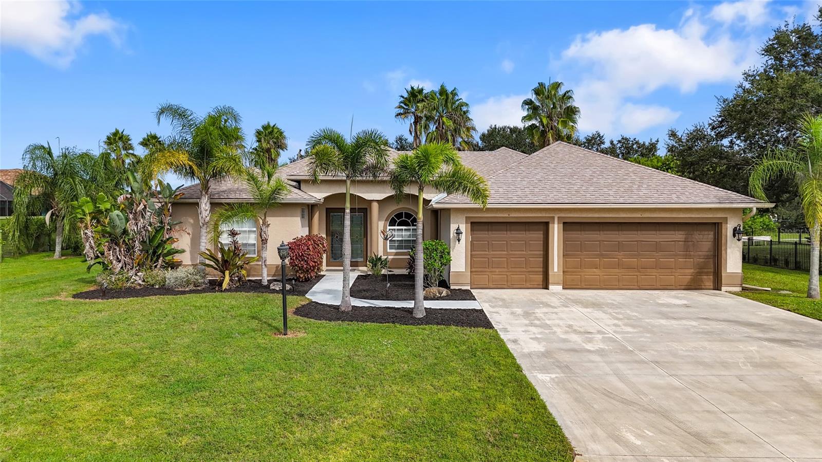 Welcome to Country Creek! This custom-built 4BR/2.5BA home sits on a spacious half-acre lot and offers a versatile split floor plan with over 500 sq ft of lanai space and beautiful lake views. Designed with future outdoor living in mind, the home is pool-ready with multiple rear access points and a guest bath positioned for easy conversion to a pool bath.
Upon entry, you’ll find two large, light-filled flex spaces overlooking the lanai—ideal for formal living/dining, office, or used as it currently is- a playroom. The kitchen features black granite countertops, ample cabinetry, and a large island with bar seating, opening to the bright family room with tray ceiling, fishbowl window, and sliding glass doors.
The layout includes two bedrooms and a full bath with exterior access in the rear wing, a third guest bedroom and half bath in the front wing, plus a spacious indoor laundry room. The private primary suite offers direct lanai access, dual vanities, a separate shower, and a garden tub.
Enjoy the oversized 537 sq ft pavered lanai and expansive backyard with just the right amount of privacy and space. This property backs to Country Creek Park with picnic area, basketball courts, and playground.
Additional features include a deep 3-car garage (29x24), new roof (2024), and AC (2017). Conveniently located near Lakewood Ranch, shopping, dining, and top-rated schools.