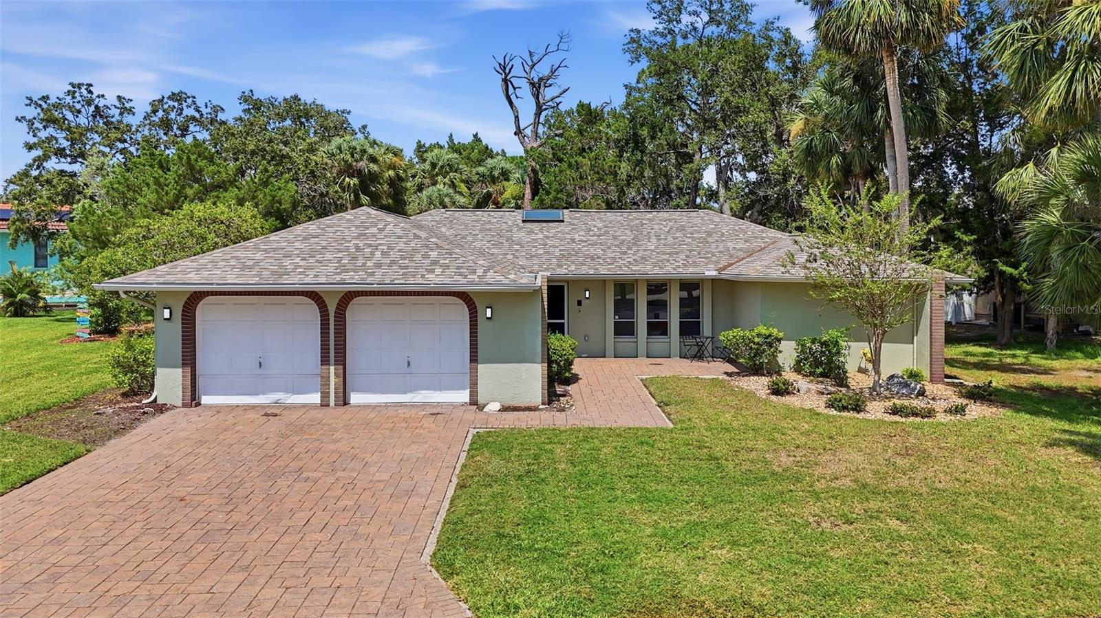 Welcome to this beautifully remodeled 3-bedroom, 2-bathroom home with a 2-car garage, perfectly positioned in the highly desirable Gulf Harbors community, where modern comfort meets the Florida coastal lifestyle.

Completely renovated and truly move-in ready, this exceptional residence offers peace of mind with a new roof (2023), new A/C system (2022), and new water heater (2022), allowing buyers to enjoy years of worry-free ownership. From the moment you step inside, you'll be greeted by an open-concept floor plan filled with natural light, luxury vinyl plank flooring, fresh paint, and designer finishes throughout.
The stunning chef-inspired kitchen serves as the centerpiece of the home, featuring custom cabinetry, quartz countertops, stainless steel appliances, and an oversized breakfast bar that seamlessly connects the living and dining spaces—perfect for entertaining guests or enjoying everyday living.

The spacious primary suite offers a relaxing retreat with ample closet space and a beautifully updated en-suite bathroom. Both bathrooms have been thoughtfully renovated with contemporary tile work, stylish vanities, and modern fixtures, creating a clean and sophisticated aesthetic. Additional bedrooms provide flexibility for guests, a home office, or family members. Step outside and experience the best of Florida living. Fresh landscaping enhances the curb appeal, while the large screened patio creates the perfect space for morning coffee, evening cocktails, or outdoor dining year-round.

As a resident of Gulf Harbors, you'll enjoy access to outstanding community amenities, including the private Gulf Harbors Beach Club, community pool, optional boat slips, and a private sandy beach along the Gulf. Waterfront dining, shopping, entertainment, parks, and everyday conveniences are all just minutes away.

Whether you're searching for a primary residence, vacation home, or investment opportunity, this property offers the ideal combination of modern upgrades, low-maintenance living, and access to one of Florida's most sought-after waterfront communities.
Experience the Gulf Harbors lifestyle—where every day feels like a vacation.