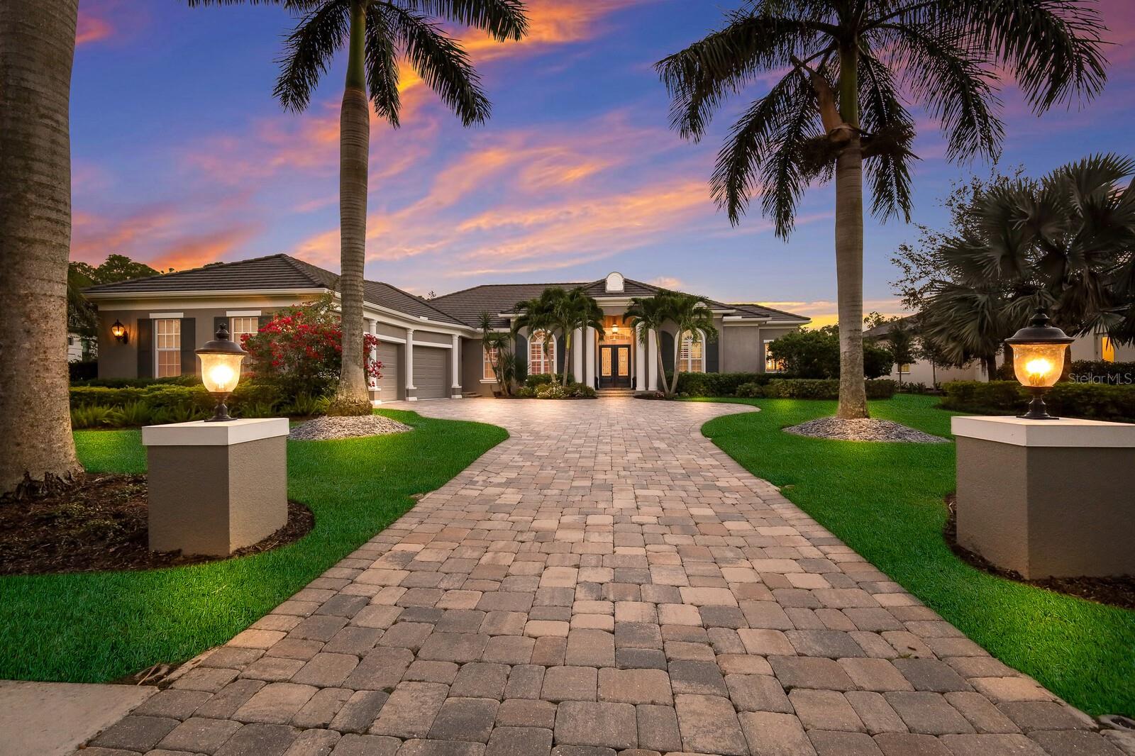 This custom John Cannon build estate home is located on a quiet private cul-de-sac and showcases unparalleled craftsmanship and attention to detail. The kitchen is a chef's dream with a walk-in pantry, new oversize quartz island, granite counters, tiled backsplash, upper and lower cabinet lighting, top-of-the-line WOLF appliances, including a 5-gas burner cooktop and wall oven. The Sub-Zero refrigerator and wine closet add to the culinary appeal.
Throughout the main living area of the home, you'll find new 23.5" tiled flooring, creating a seamless and elegant aesthetic. The great room is a focal point, featuring a gas fireplace with a striking tiled accent wall extending to the ceiling, high ceilings, Crown molding and French Doors.
The property boasts two guest bedrooms, each with walk-in closets and full En-suite baths. One guest bedroom has been tastefully remodeled, showcasing new engineered wood flooring, new bath with walk in shower and custom closet space. The den, located near the convenient half bath, is complete with engineered wood flooring, offers a versatile space for work, play or relaxation.   The office offers built in shelving, engineered wood flooring, French doors and plantation shutters. Upon entering the owner's suite, it is a true retreat, featuring a tiled shower that extends to the ceiling, a luxurious jetted tub, dual vanities with a makeup counter, and two large walk-in closets with custom built ins.  An impact door provides convenient access to the outdoor living area.
Beyond the interiors, the three-car garage, paver driveway, and impact windows and doors provide convenience, and peace of mind. The outdoor space is a haven with a large under-cover lanai overlooking the lake, an outdoor kitchen with a gas grill and tiled backsplash, and a saltwater heated pool, perfect for entertaining and enjoying peaceful moments.
Situated in The Concession Golf Club, this home is part of a private gated community surrounded by 1200 acres of 200-year-old oaks, preserves, protected wetlands, and lakes. The proximity to renowned beaches like Lido Key, Siesta Key, and Anna Maria Island, along with shopping destinations like UTC Mall and Waterside Place, and easy access to downtown Sarasota, Tampa, and Sarasota Airports makes this property a unique blend of luxury and convenience. It's not just a home; it's a lifestyle, complemented by the rich history of The Concession Golf Club where golf legends Tony Jacklin and Jack Nicklaus became forever linked by the memorable 1969 Ryder Cup, where Nicklaus graciously conceded a short putt to Jacklin, resulting in a historic match.  The PGA World Champions Cup is set to make its debut at Concession December 7-10, 2023. Room Feature: Linen Closet In Bath (Bedroom 2). Bedroom Closet Type: Walk-in Closet (Primary Bedroom).
