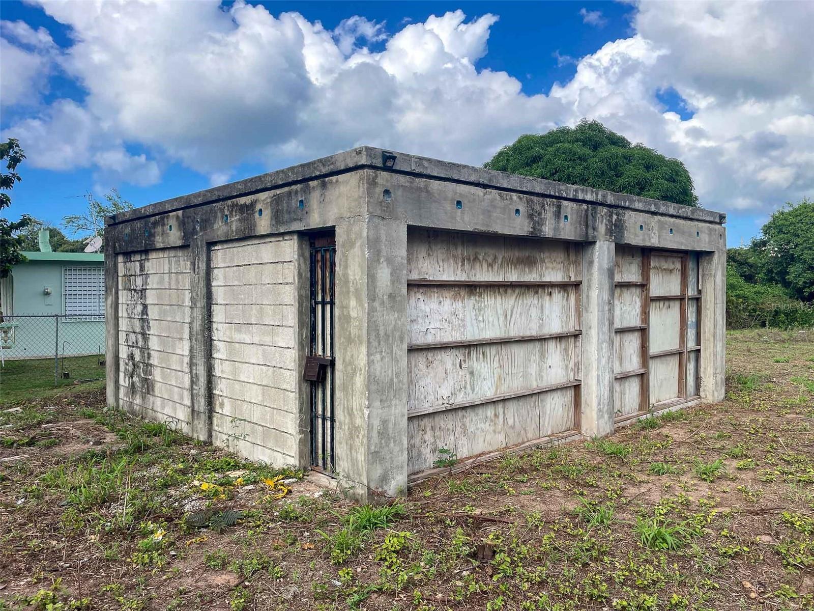 Rare opportunity to own 1.25 acres in the desirable Monte Santo Playa neighborhood of Vieques, Puerto Rico. Located close to of one of the island's beautiful sandy beaches, this mostly level parcel offers an excellent foundation for a private residence, vacation retreat, or income-producing property.

The property includes an existing two-car garage of approximately 528 square feet, a 150-square-foot casita shell, and an additional 252-square-foot foundation, providing a head start for future development. Utilities are nearby, and the property's flat topography offers flexibility for a variety of building plans.

Conveniently situated between Isabel Segunda, Esperanza, and the Vieques airport, the location provides easy access to restaurants, shopping, schools, marinas, beaches, and the island's many natural attractions. The surrounding neighborhood is primarily composed of single-family homes, creating a peaceful residential setting with minimal through traffic.

Vieques is known for its unspoiled beaches, protected wildlife refuge, world-famous bioluminescent bay, and relaxed Caribbean lifestyle. Whether you're seeking to build a personal island getaway, a long-term rental investment, or a multi-unit residential project (subject to permitting and approvals), this property offers exceptional potential in one of Puerto Rico's most unique island communities.

Don't miss the opportunity to secure a sizable parcel in a sought-after beachside neighborhood and create your vision in paradise.