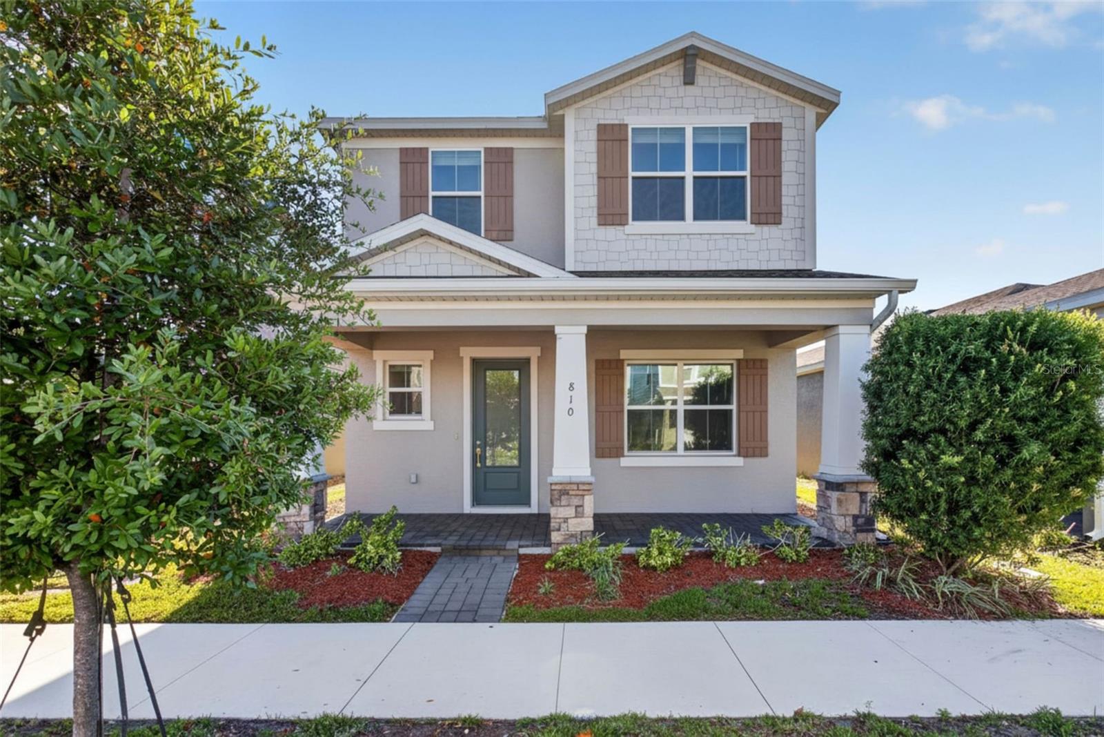 Welcome to this stunning 2022-built single-story Craftsman home in the highly desired Rivington community! Offering an expansive 2,200 s/f layout, this 4BR/2BA detached residence blends modern elegance with effortless living. The heart of the home features a light-filled great room that flows into a gourmet kitchen with a massive center island and dining combo. Retreat to the private primary suite, featuring an en-suite bath and a walk-in closet. Three secondary bedrooms sit in a split-plan configuration. Constructed with durable concrete block, a slab foundation, and central electric HVAC, the home features ceramic tile flooring and a dedicated indoor laundry room. Step out onto the covered rear lanai or enjoy community amenities such as the resort-style pool and clubhouse.