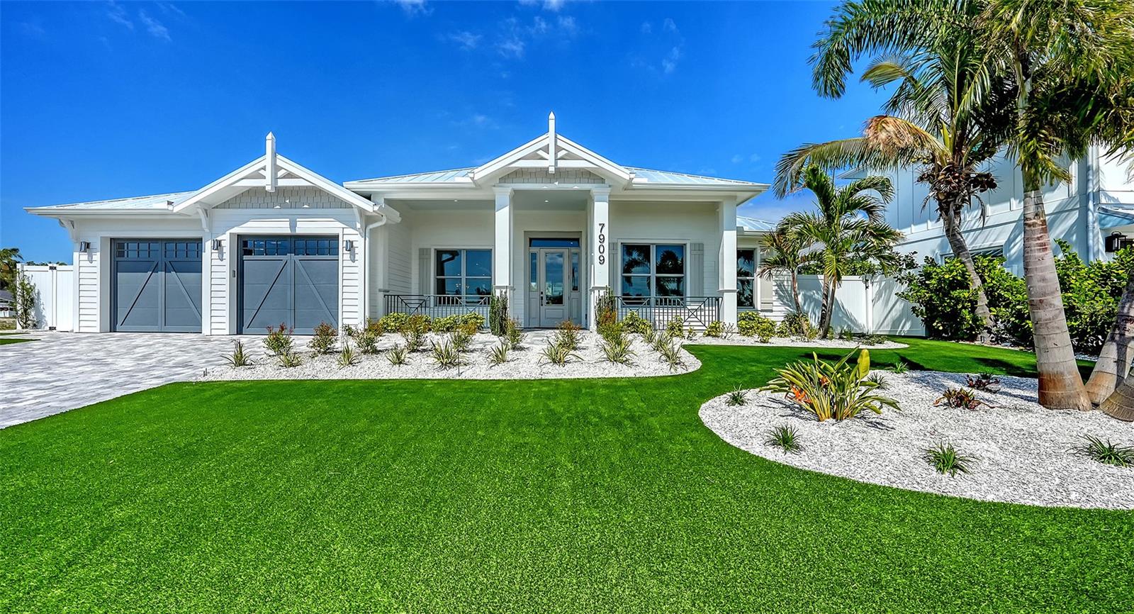 Pre-Construction. To be built. AWARD-WINNING COASTAL MASTERPIECE | Palma Sola Bay Views | No CDD Fee | Out of Flood Plain

**RARE GATED BAYFRONT LIVING – Secure your dream home in Palma Sola Grande, an exclusive 16-home enclave overlooking Palma Sola Bay in West Bradenton. This is THE KEY MODEL – a Parade of Homes Community Award Winner that sold out as the model home!
4 BD | 3.5 BA | Single-Story Coastal Contemporary | Pre-Construction

**ARCHITECTURAL HIGHLIGHTS: Vaulted ceilings crown the great room, ALL four-bedroom suites, AND the private office – creating an expansive, light-filled sanctuary throughout. Soaring windows flood every room with natural light and coastal breezes.

**CHEF'S DREAM KITCHEN: High-end stainless-steel appliances | Stunning quartz countertops | Open-concept design flows seamlessly into great room – built for entertaining

**PRIMARY RETREAT: TWO oversized walk-in closets | Spa-inspired ensuite with freestanding soaking tub | Frameless glass walk-in shower | Sleek contemporary finishes

**RESORT-STYLE OUTDOOR OASIS: Custom heated saltwater pool & spa | Complete outdoor kitchen | Lush tropical landscaping (front & fenced rear) | Your private paradise awaits

***PREMIUM FEATURES: Oversized 2-car garage ? Metal roof system (durability & energy efficiency) Hurricane impact-resistant windows & doors throughout Low-maintenance tropical landscaping

**UNBEATABLE LOCATION: Minutes to Gulf Beaches & Anna Maria Island | IMG Academy & Golf Course | Robinson Preserve (682-acre nature paradise – walk or bike!) | Historic DeSoto National Park | Downtown Bradenton & St. Pete | Sarasota's arts & dining scene | Nearby marinas for your boat | Shopping, dining & medical facilities

**THIS IS FLORIDA LIVING AT ITS FINEST – Bayfront views, award-winning design, resort amenities, and endless recreation at your doorstep.

**This Community is selling fast! Price excludes lot premium and custom pool package.

**Photos show the completed SOLD model. 
Schedule your private tour NOW before this exclusive community sells out!