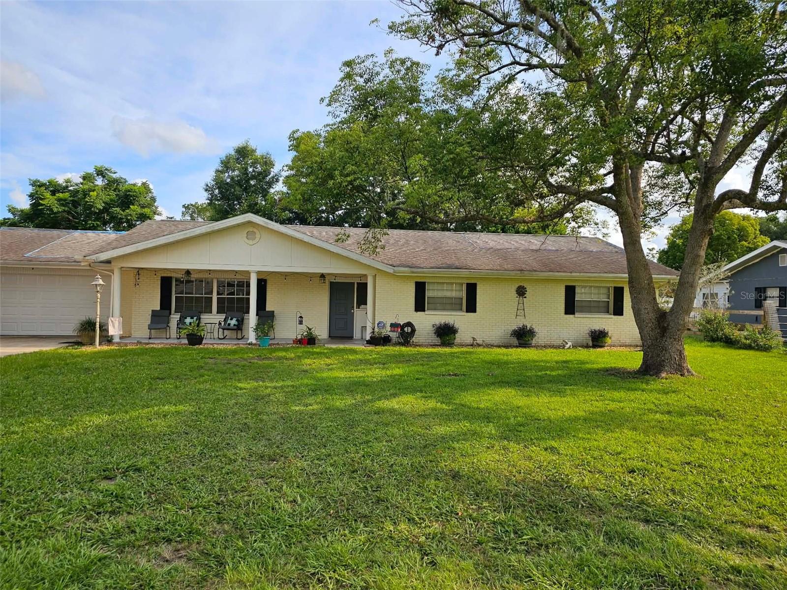 Auction Property. LIST PRICE IS FOR MLS PURPOSES ONLY. ACTUAL PRICE WILL BE DETERMINED AT AUCTION. ONLINE AUCTION ENDS JULY 29 AT 12 PM ET. Welcome home to this inviting 3 bedroom, 2 bathroom residence nestled in the desirable Inverness Golf & Country Club community—with NO HOA. Inside, you'll find a functional floor plan filled with warmth and character. The home features charming country inspired décor, including decorative wainscoting with crown molding accents, tray ceilings, open shelving in the galley style kitchen, and thoughtfully designed living spaces that create a cozy, inviting atmosphere. Large sliding glass doors open to a climate-controlled Florida room, providing additional year-round living space. The two car garage offers additional space for storage and utility. The backyard offers plenty of room for pets, gardening, outdoor entertaining, or simply enjoying the spacious yard. The primary bathroom features a convenient step-in shower and claw foot tub. The home offers an excellent opportunity for buyers looking to add their own personal touches. While some deferred maintenance is needed, including attention to the roof, there are no visible interior leaks, making this an ideal sweat equity opportunity for someone looking to update and build value while preserving the home's welcoming charm and unique character. Enjoy the benefits of living in an established golf course community without mandatory HOA fees. Part-time and full-time memberships are available for purchase at the Inverness Golf & Country Club, providing access to golf, tennis courts, pickleball courts, and a swimming pool. Conveniently located just minutes from historic downtown Inverness, you'll enjoy easy access to charming boutiques, local restaurants, medical facilities, and year-round festivals and community events. Outdoor enthusiasts will appreciate being just moments from the Withlacoochee State Trail, offering 47± miles of paved trails. The area also boasts numerous lakes, public boat ramps, and excellent fishing opportunities, making it easy to enjoy the best of Florida's outdoor lifestyle. Property #: DG26031. Bid Online July 22 - 29. Subject to the final bid at the online auction and auction terms. 10% Buyer's Premium.